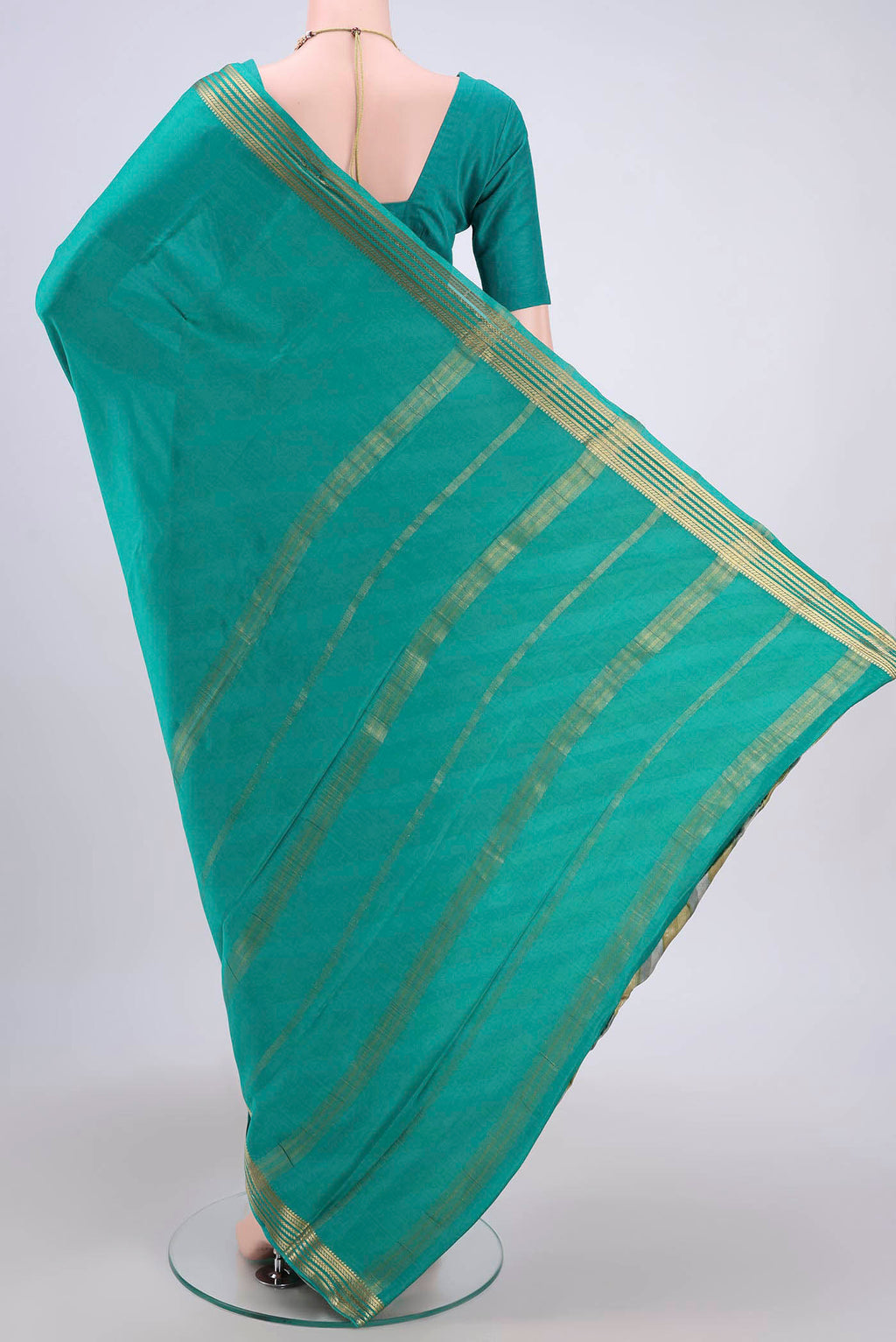 Flat view of Sea Green Mysore Crepe Saree with Plain Body and Zari Border. 
