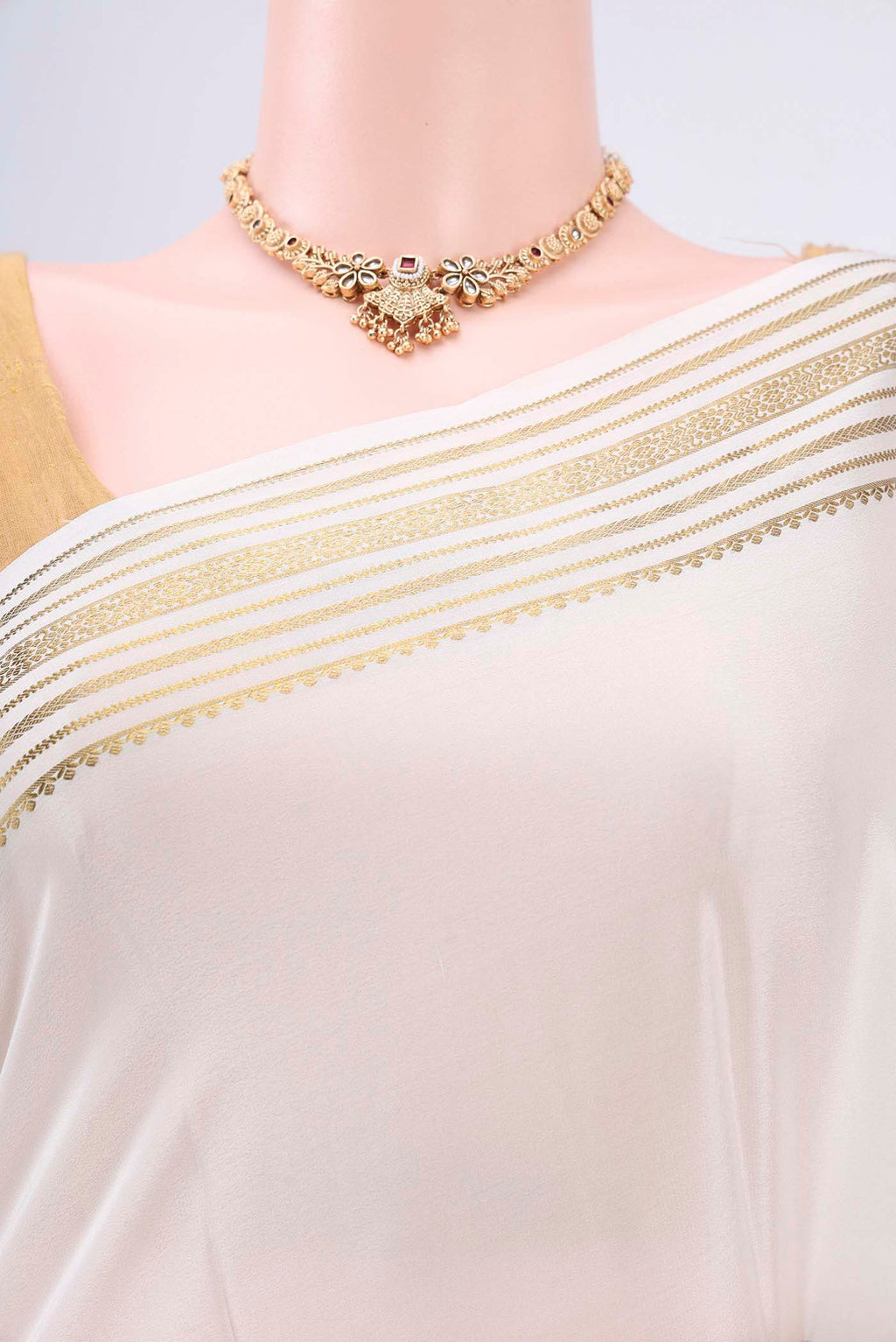 Border image of Off White Mysore Crepe Saree with Plain Body and Zari Border. 