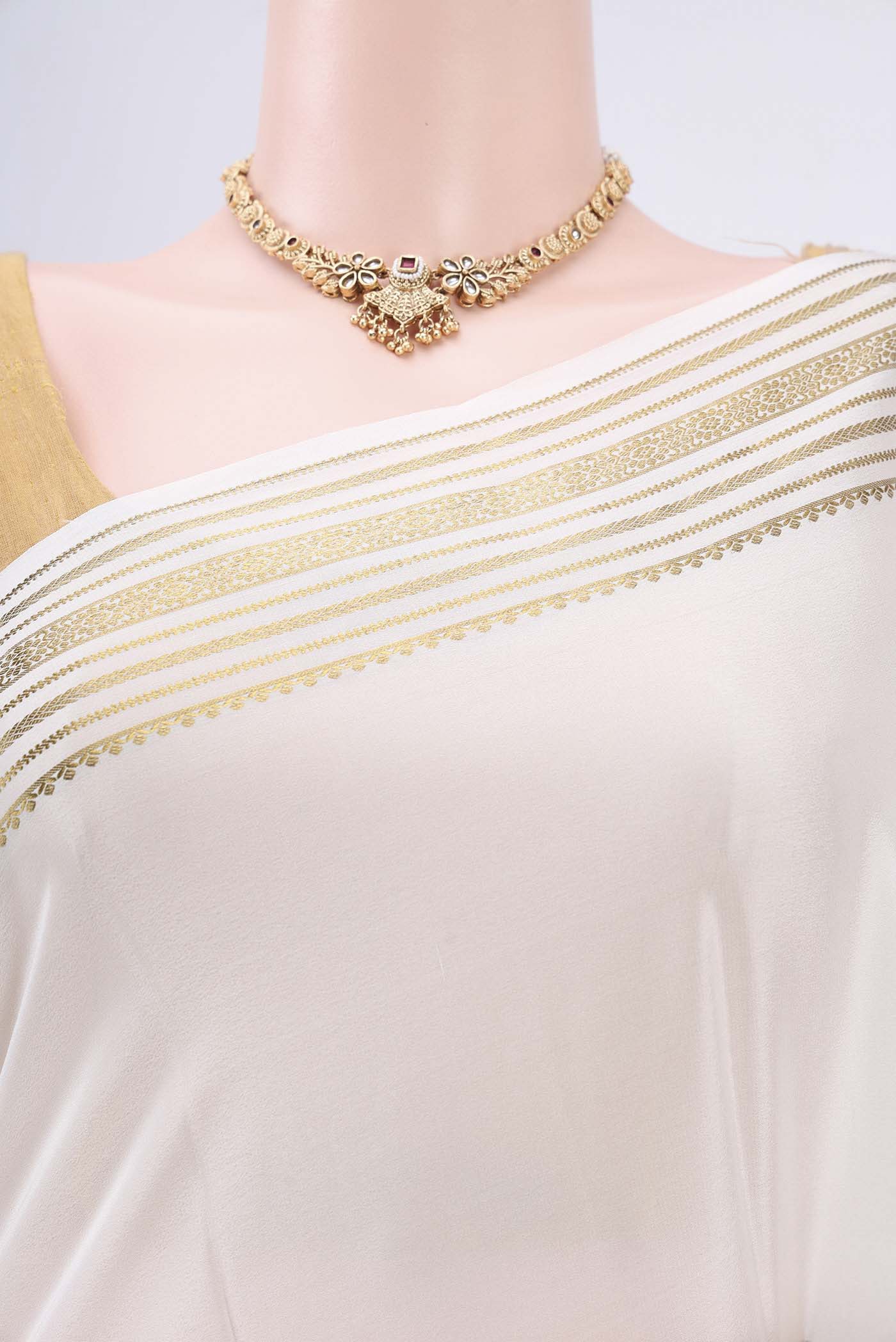 Border image of Off White Mysore Crepe Saree with Plain Body and Zari Border. 