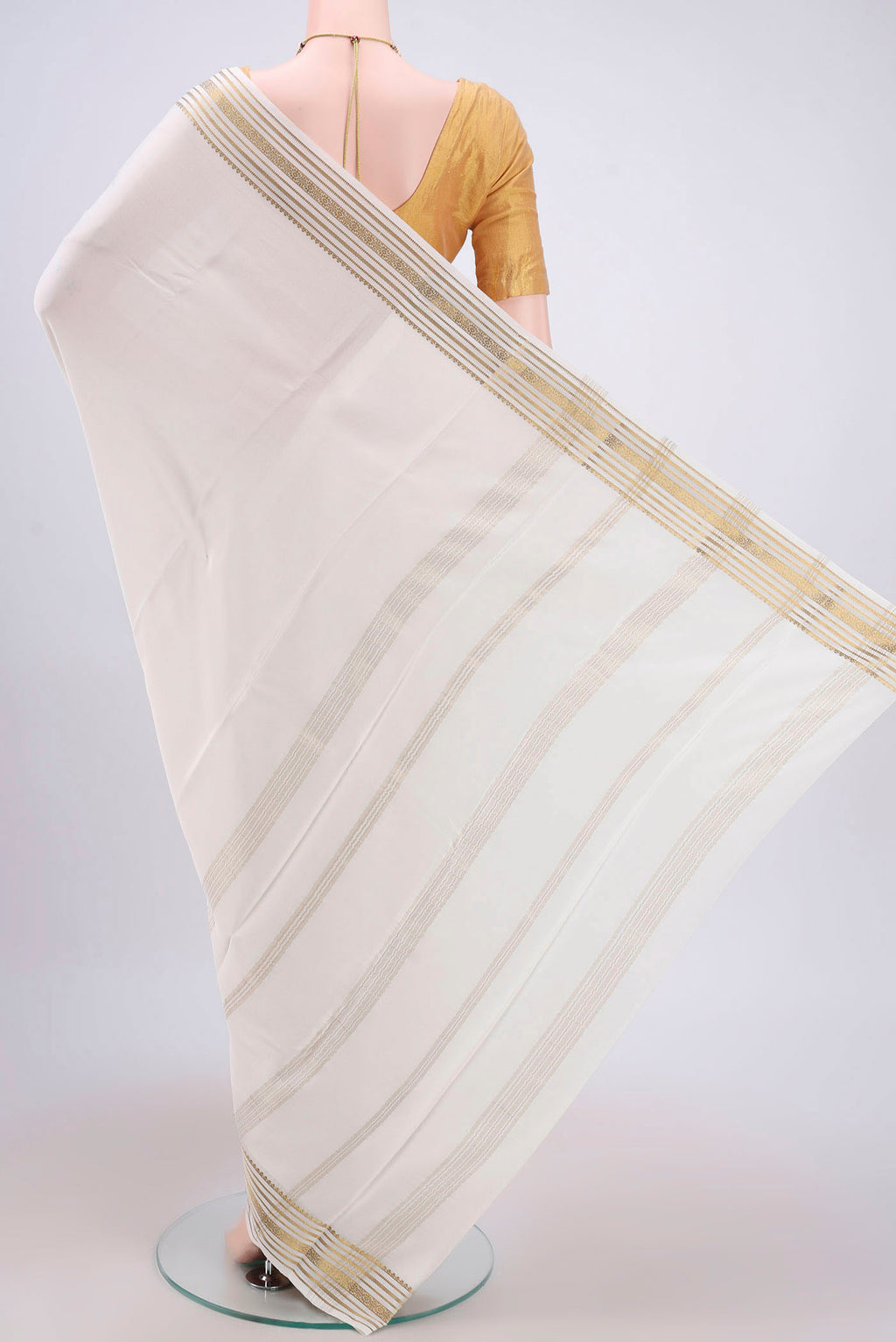 Flat view of Off White Mysore Crepe Saree with Plain Body and Zari Border. 