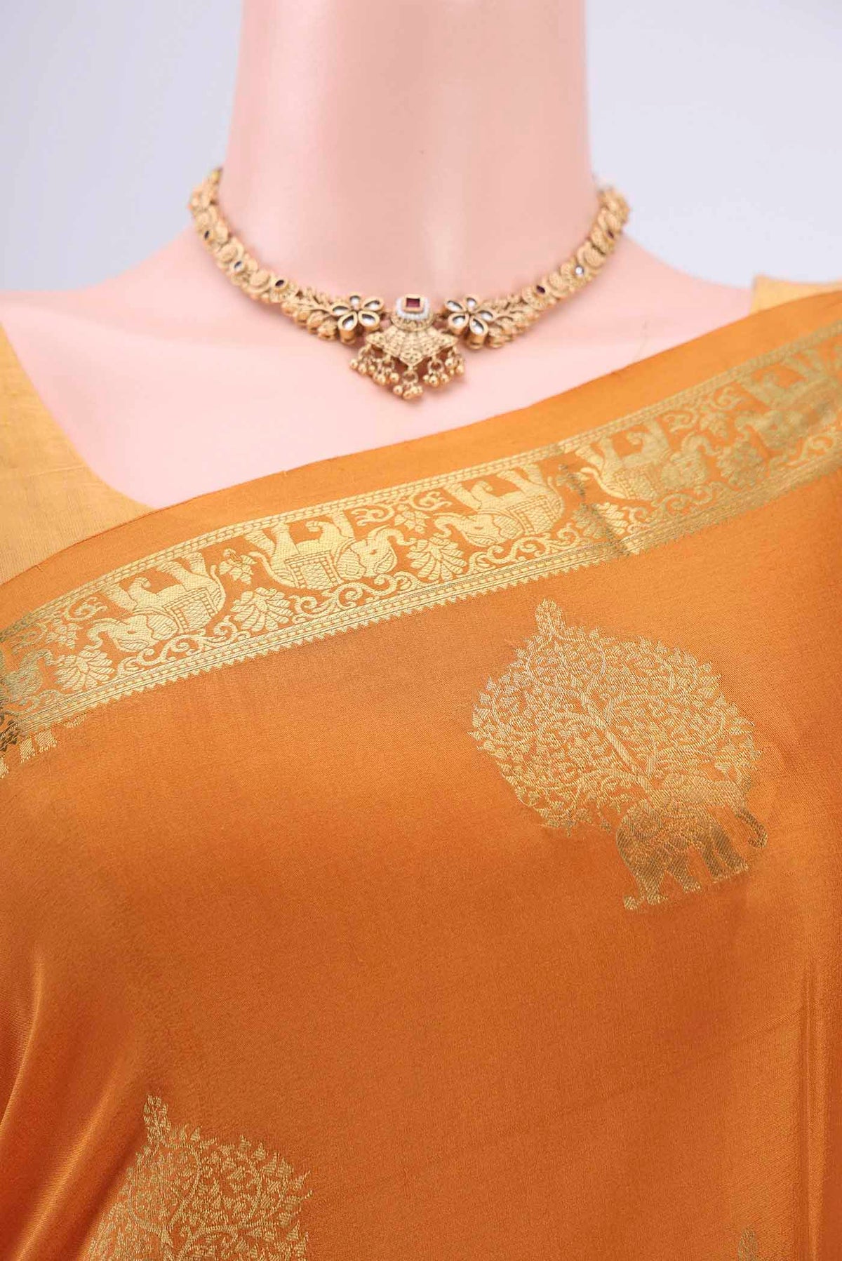 Border image of Mustard Mysore Crepe Saree with Zari Butta on the body and Zari Border. 