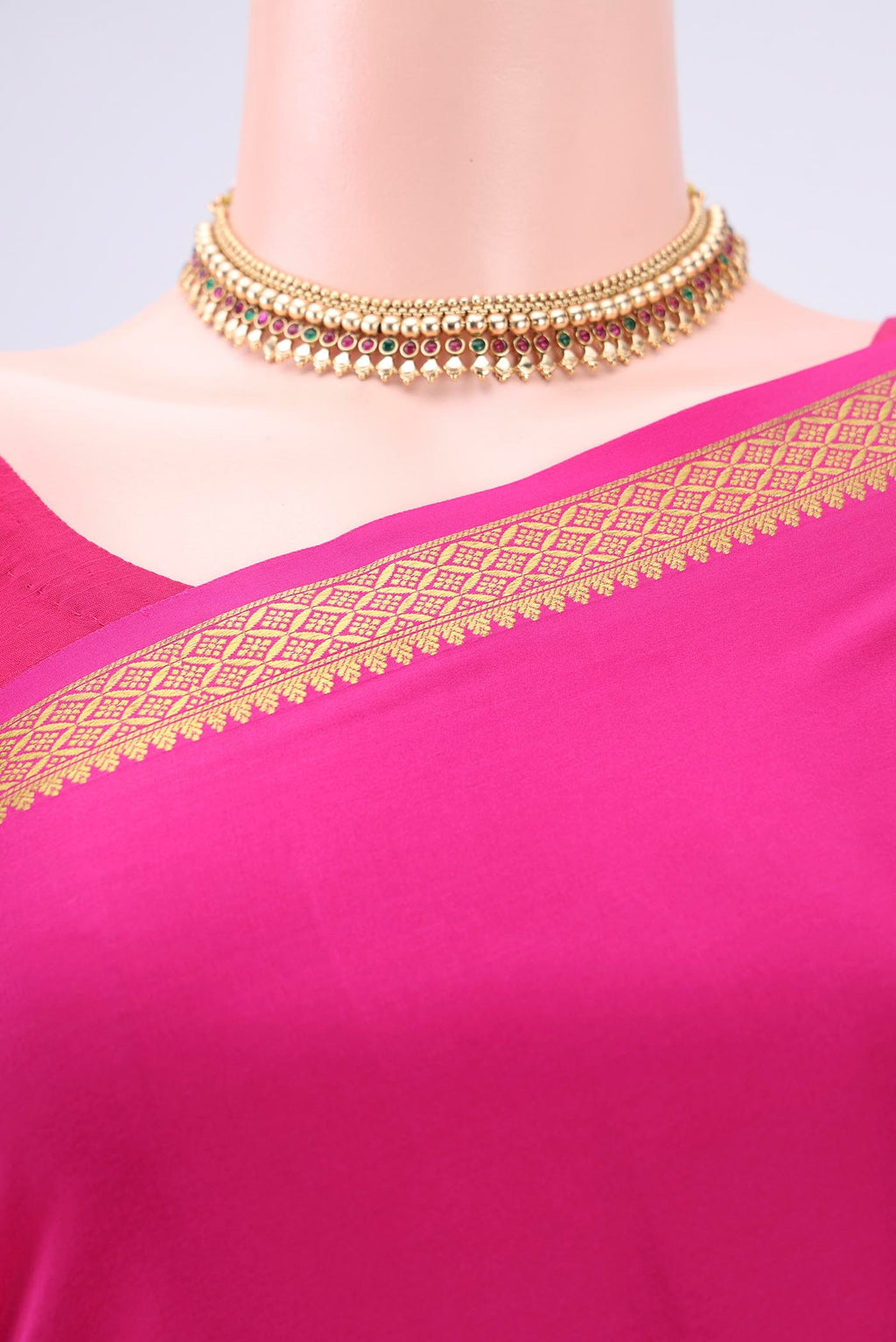 Border image of Rani Pink Mysore Crepe Saree with Plain Body and Zari Border. 