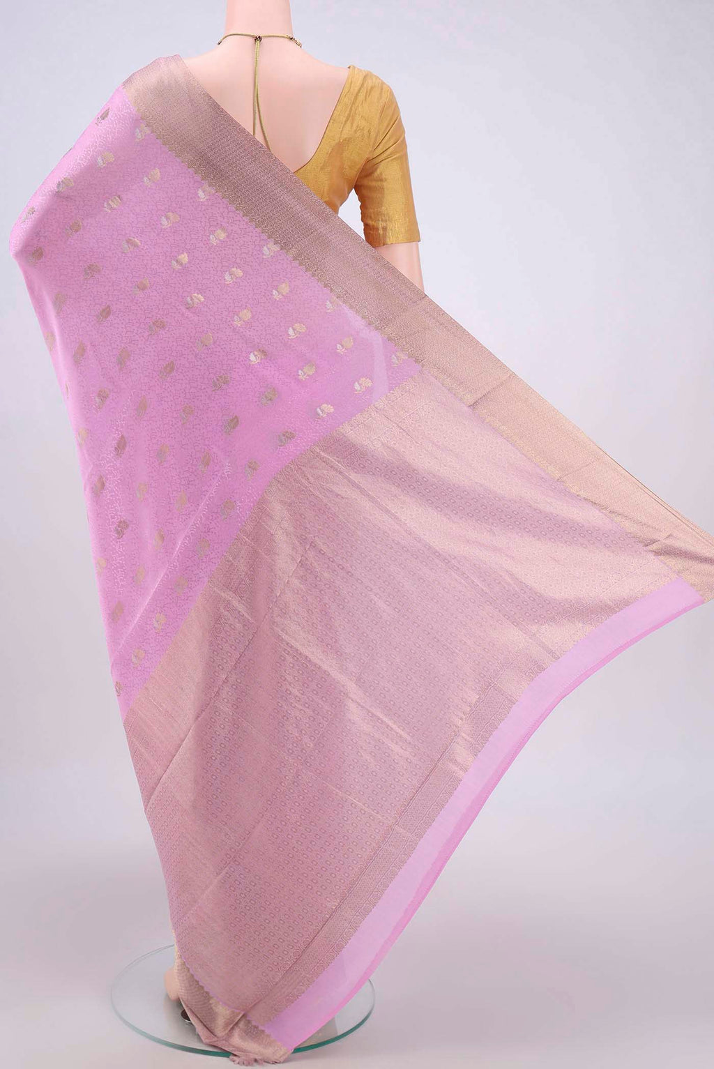 Flat view of Rose pink Mysore Crepe Saree with Zari Butta on the body and Zari Border. 