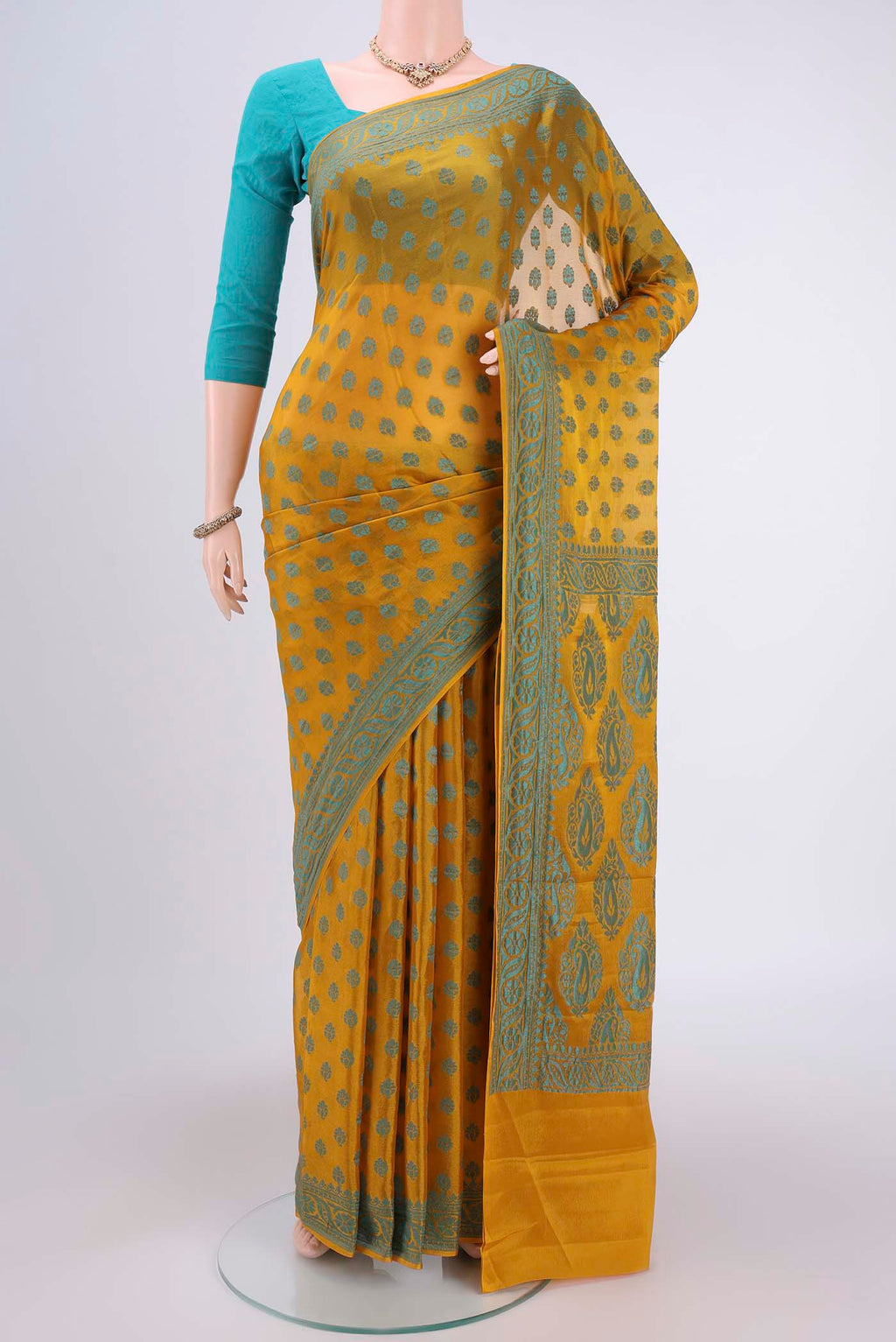 Yellow Blended Banarasi Georgette Saree with Thread Butta on the body and Thread Border.  displayed on a mannequin