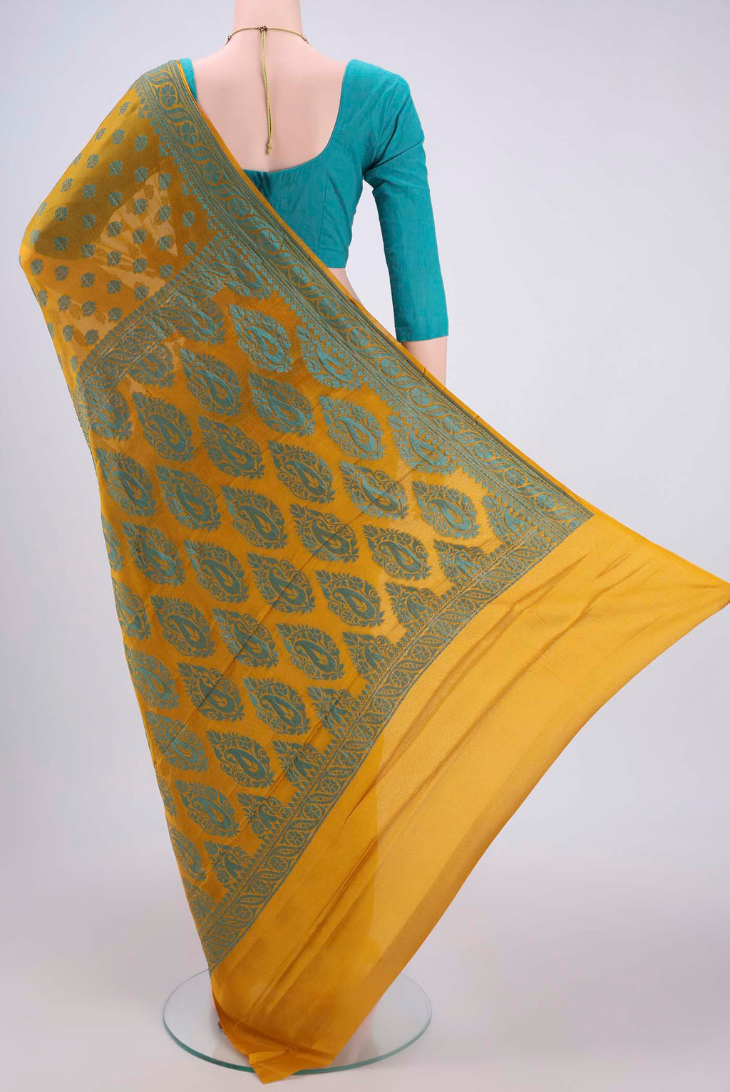 Flat view of Yellow Blended Banarasi Georgette Saree with Thread Butta on the body and Thread Border. 