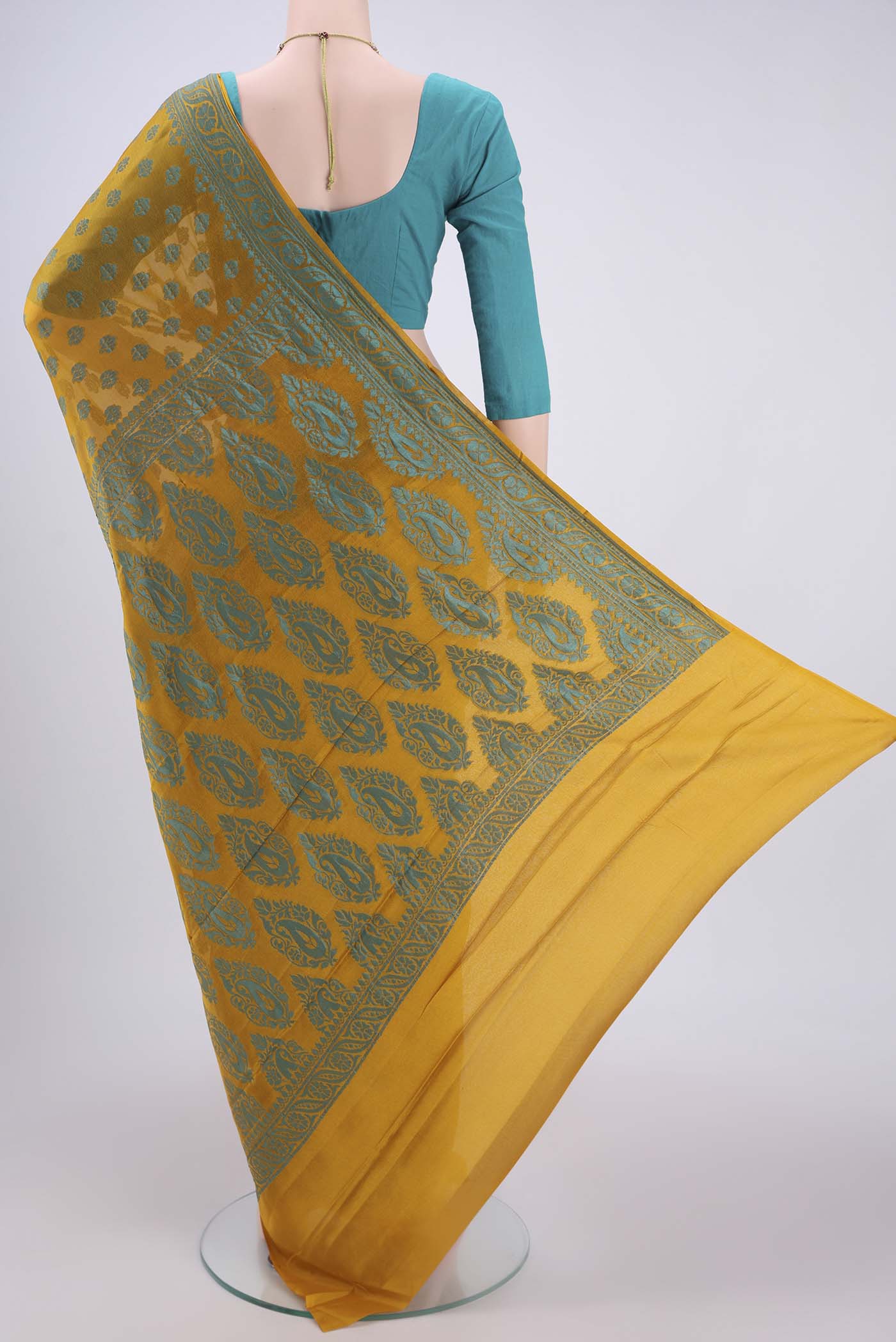 Flat view of Yellow Blended Banarasi Georgette Saree with Thread Butta on the body and Thread Border. 