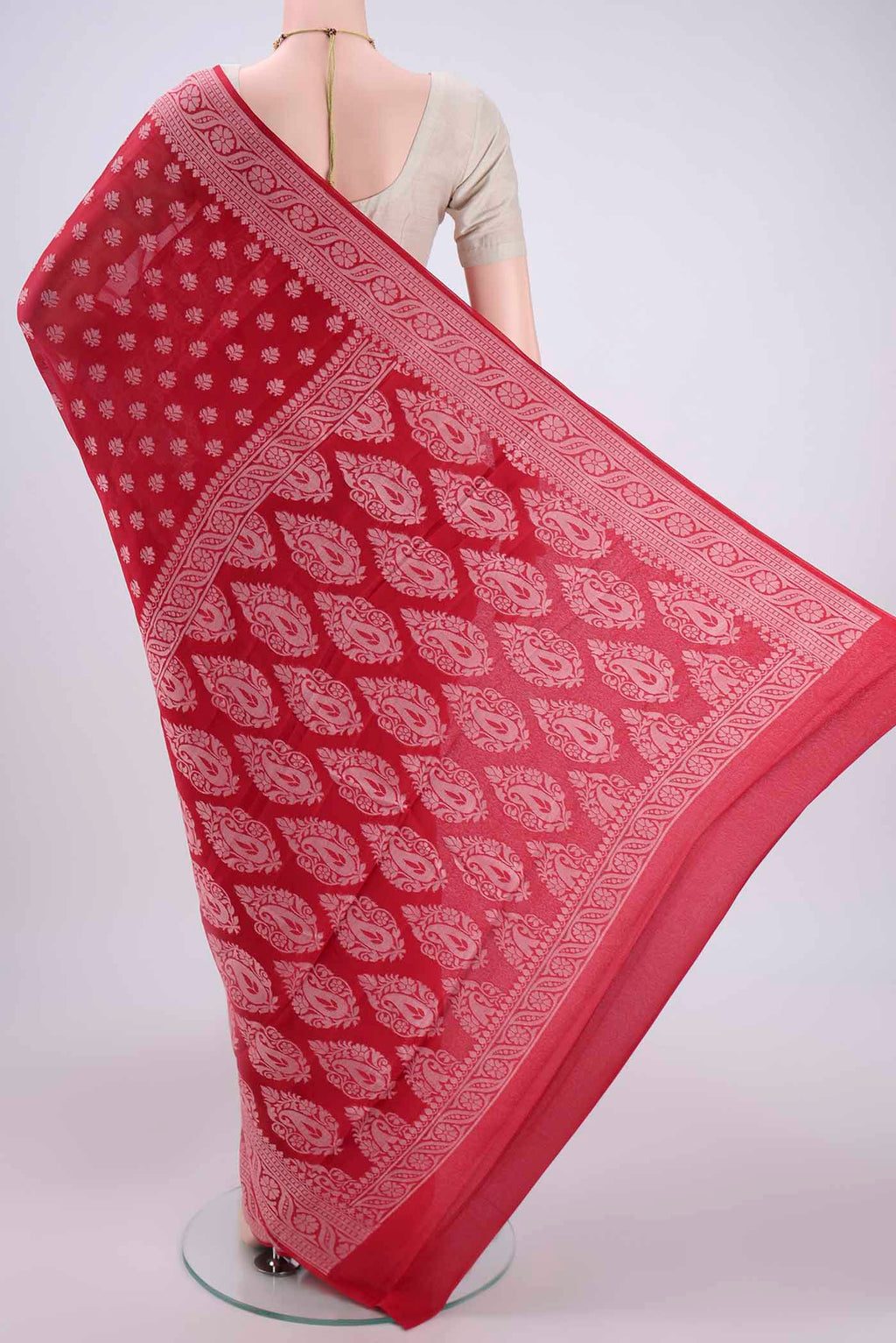 Flat view of Red Blended Banarasi Georgette Saree with Thread Butta on the body and Thread Border. 