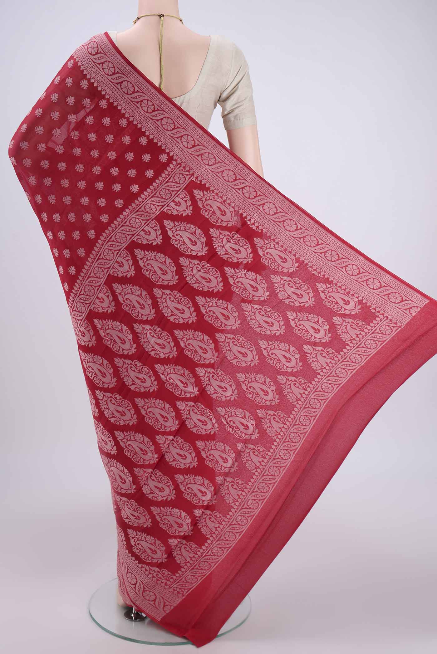 Flat view of Red Blended Banarasi Georgette Saree with Thread Butta on the body and Thread Border. 