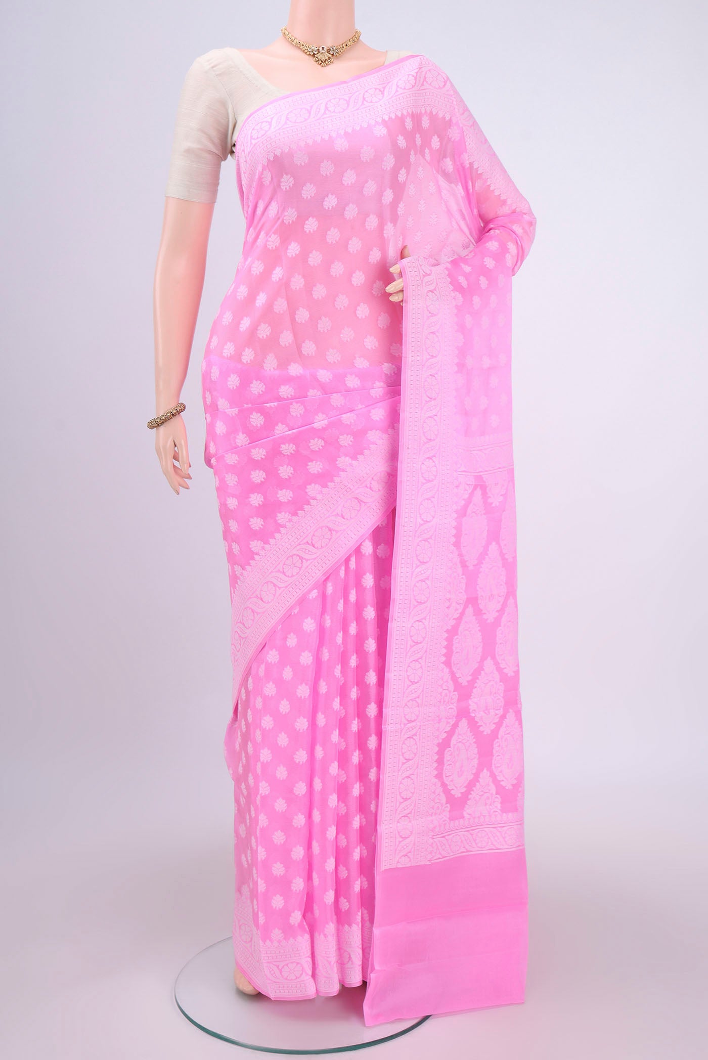 Rose pink Blended Banarasi Georgette Saree with Thread Butta on the body and Thread Border.  displayed on a mannequin