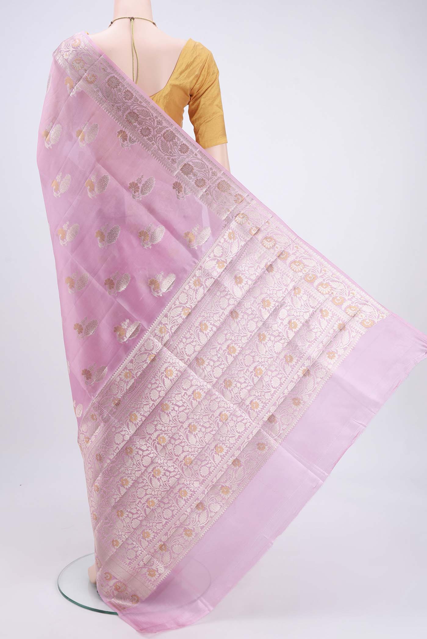 Flat view of Rose pink Banarasi Raw Silk Saree with Zari Butta on the body and Zari Border. 