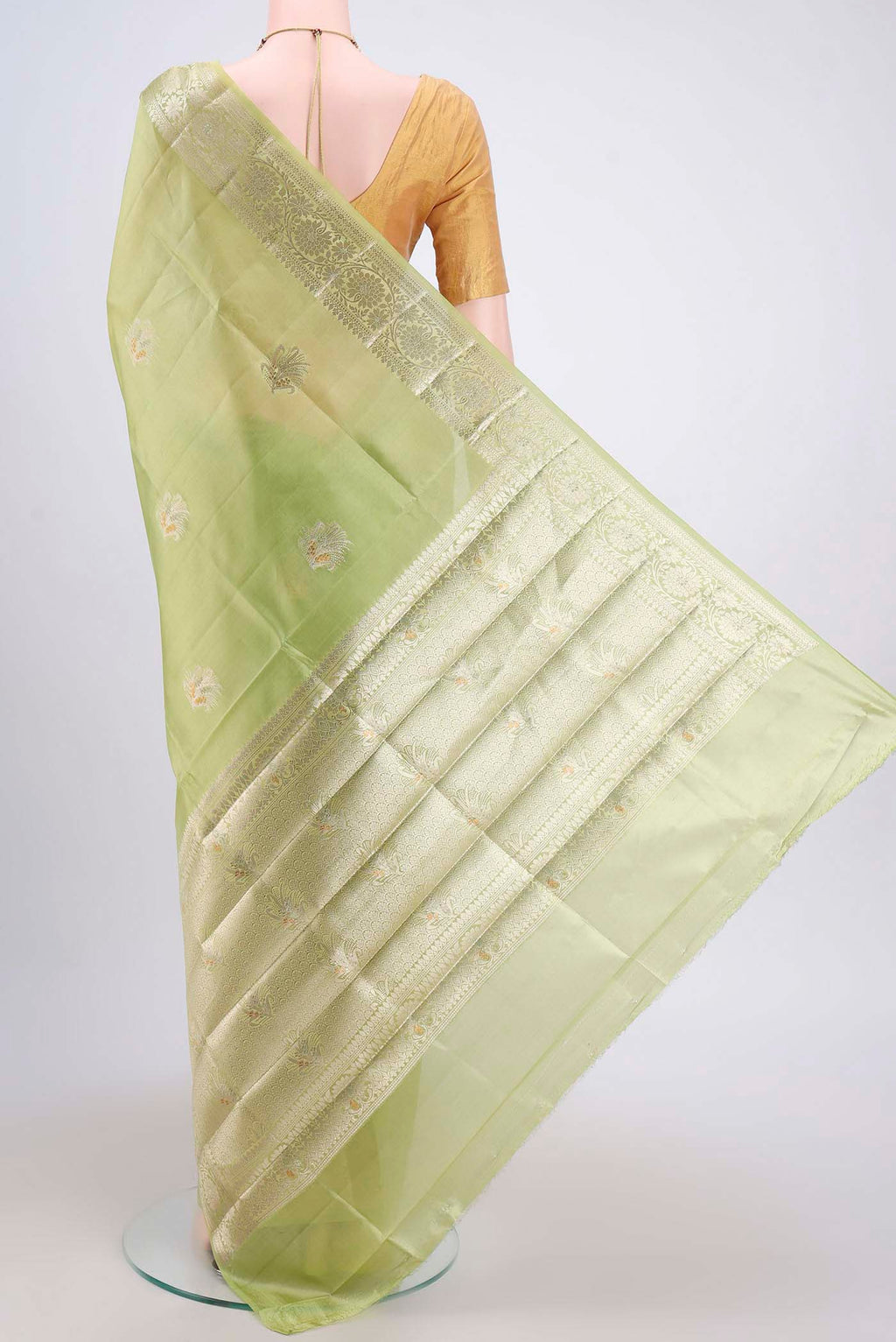 Flat view of Acid Green Banarasi Raw Silk Saree with Zari Butta on the body and Zari Border. 