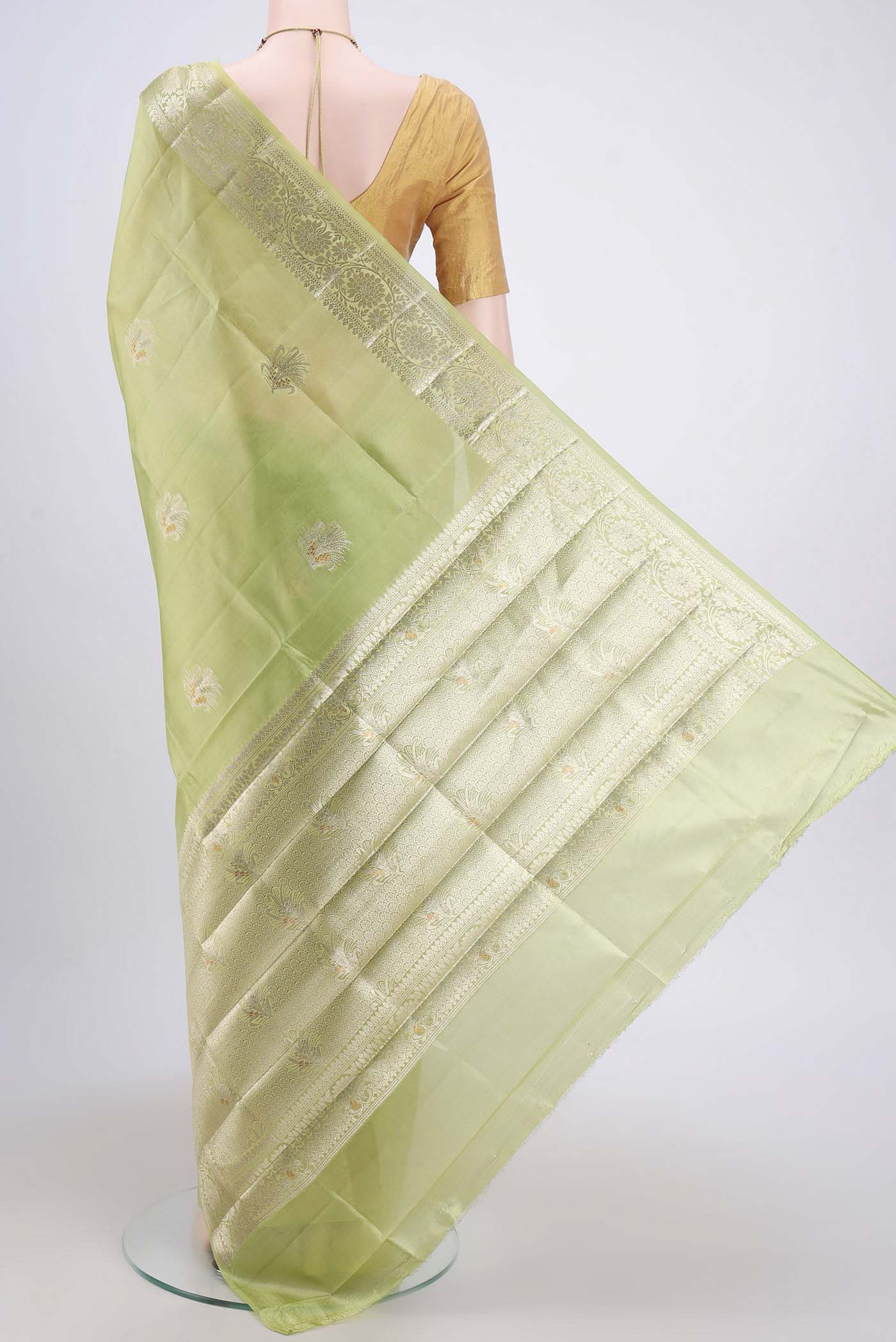 Flat view of Acid Green Banarasi Raw Silk Saree with Zari Butta on the body and Zari Border. 