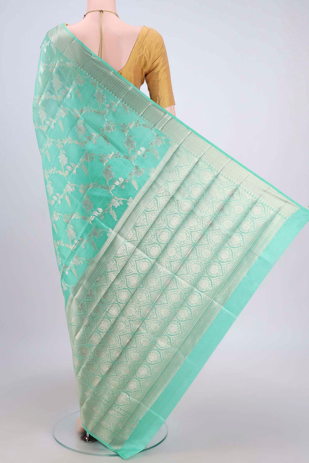 Flat view of Mint Green Banarasi Raw Silk Saree with Zari Brocade on the body and Zari Border. 