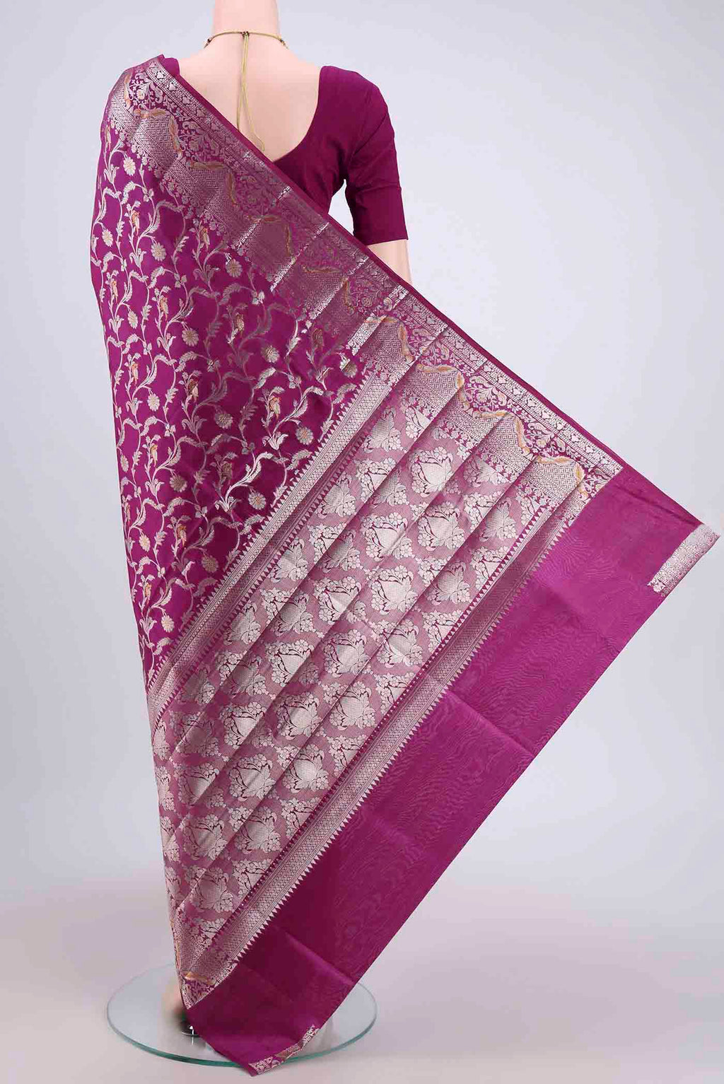 Flat view of Magenta Banarasi Raw Silk Saree with Zari Brocade on the body and Zari Border. 