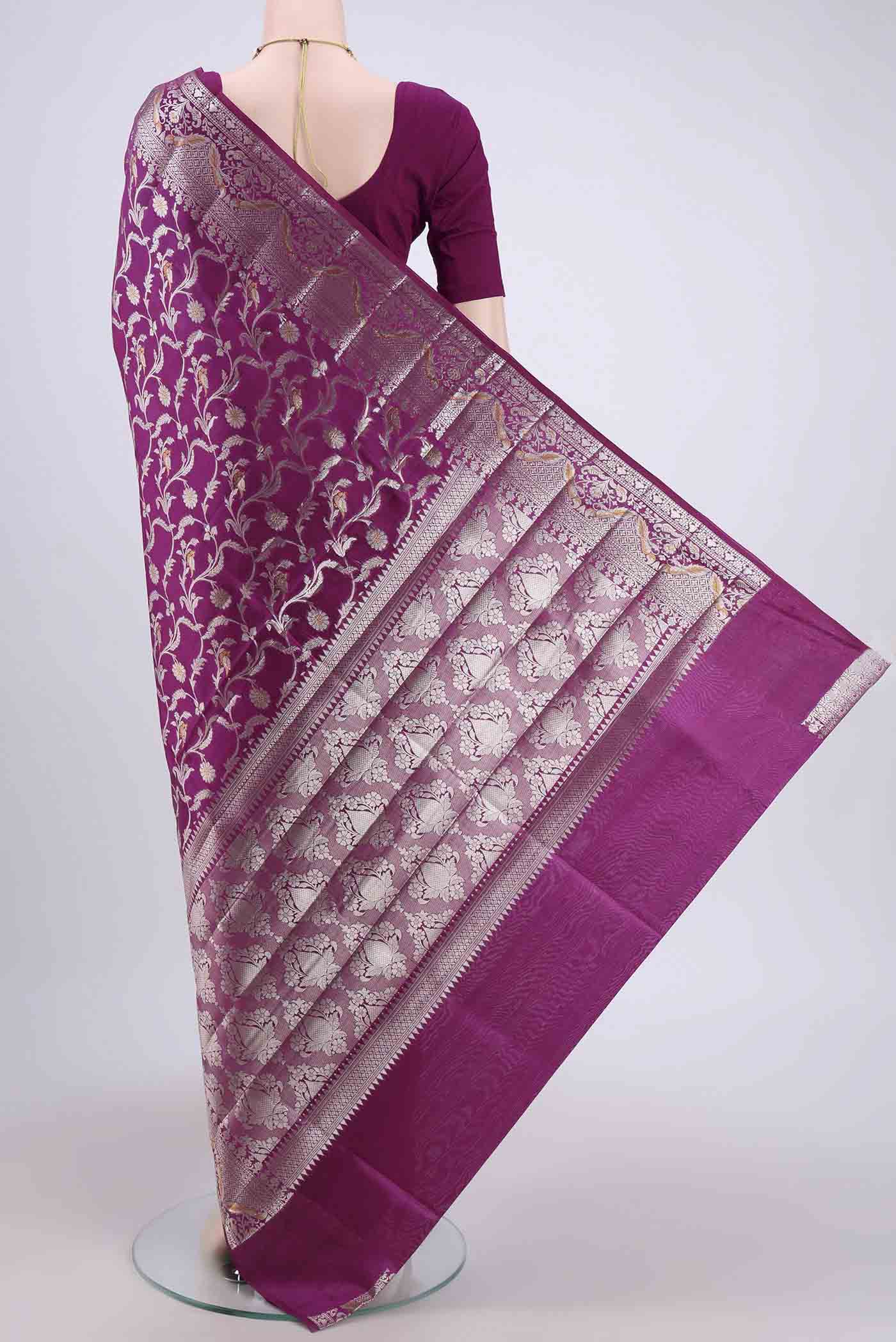 Flat view of Magenta Banarasi Raw Silk Saree with Zari Brocade on the body and Zari Border. 