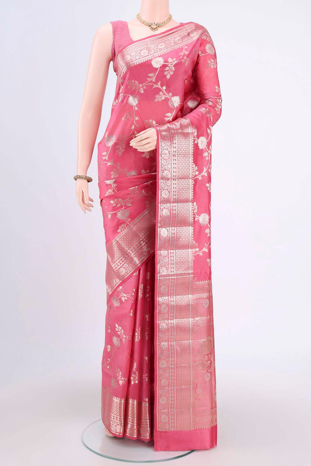 Pink Banarasi Raw Silk Saree with Zari Butta on the body and Zari Border.  displayed on a mannequin