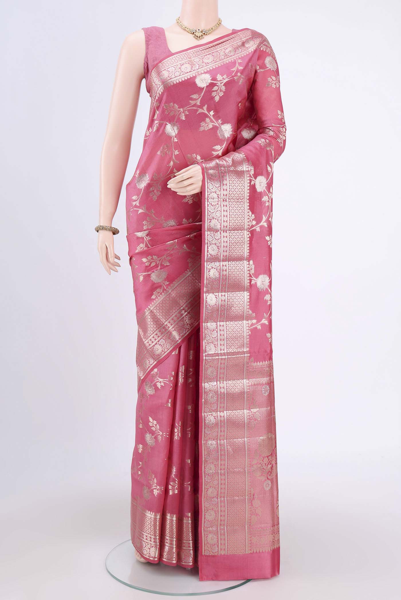 Pink Banarasi Raw Silk Saree with Zari Butta on the body and Zari Border.  displayed on a mannequin