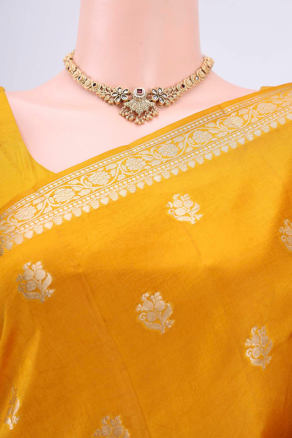 Border image of Mustard Banarasi Raw Silk Saree with Zari Butta on the body and Zari Border. 