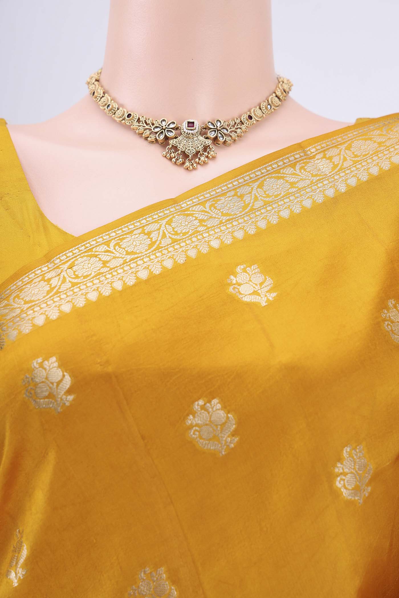 Border image of Mustard Banarasi Raw Silk Saree with Zari Butta on the body and Zari Border. 