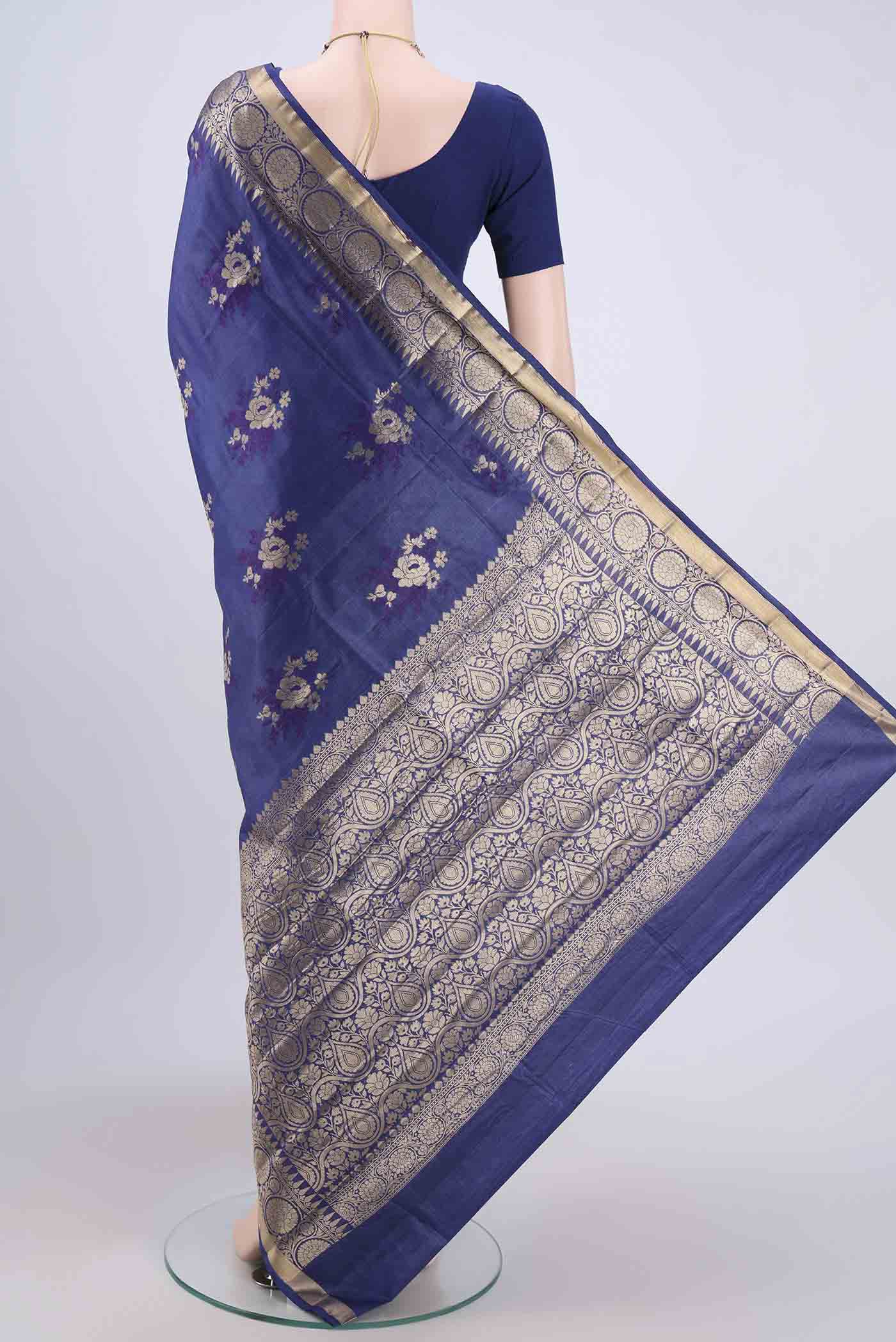 Flat view of Purple Banarasi Tussar Silk Saree with Zari Butta on the body and Zari Border. 