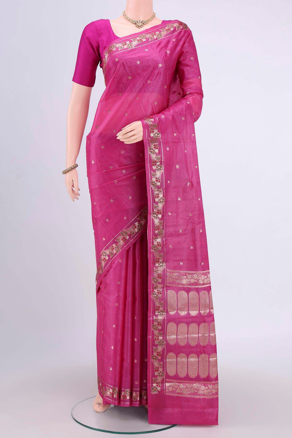 Rani Pink Banarasi Tussar Silk Saree with Zari Butta on the body and Zari Border.  displayed on a mannequin