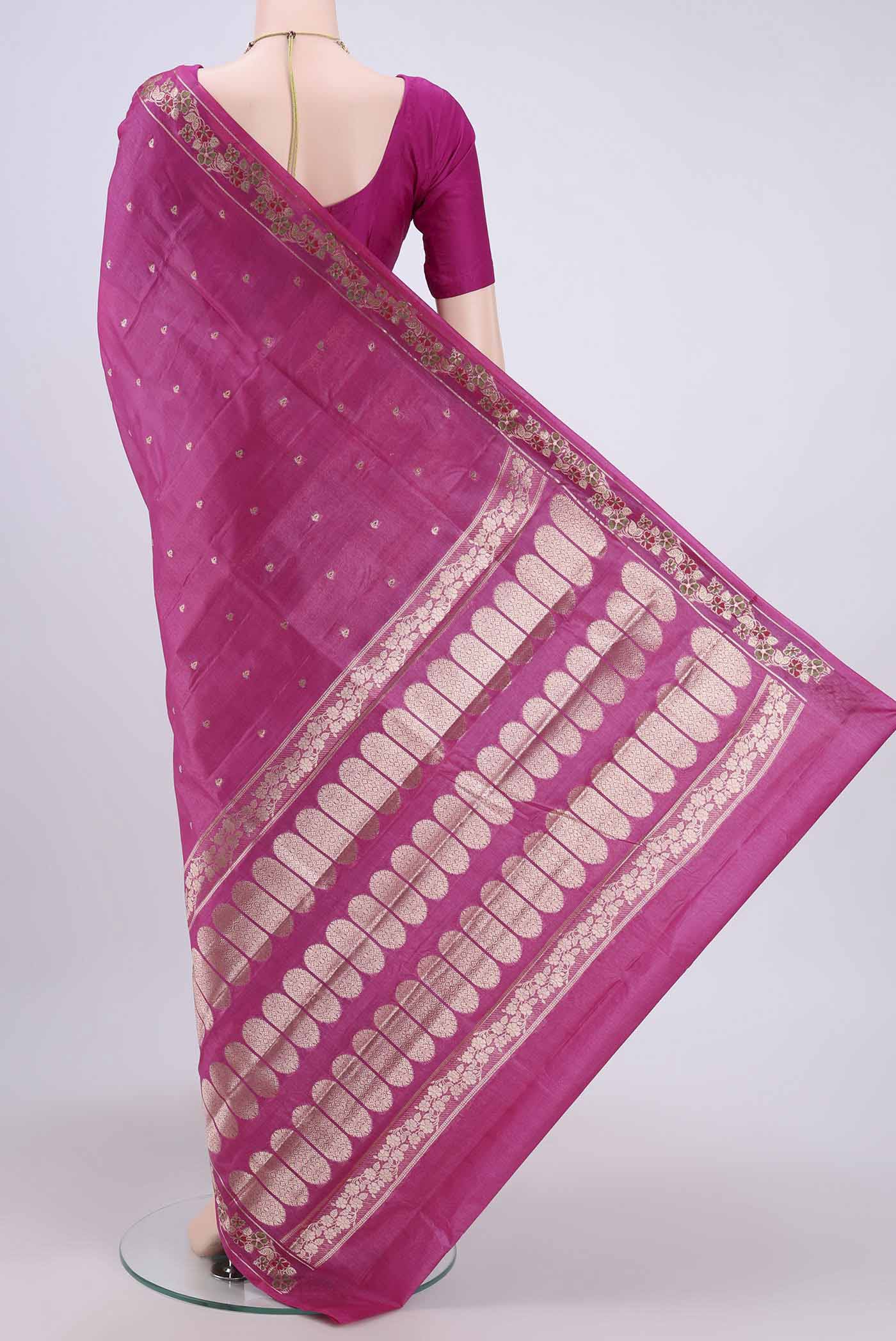 Flat view of Rani Pink Banarasi Tussar Silk Saree with Zari Butta on the body and Zari Border. 