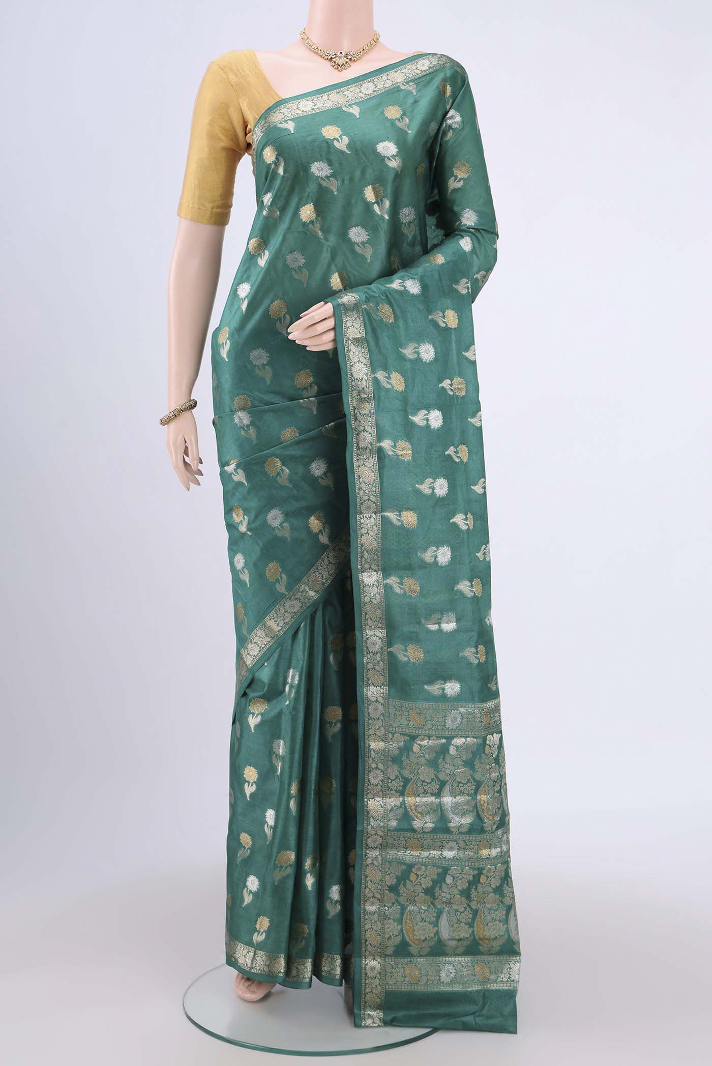 Sea Green Banarasi Tussar Silk Saree with Zari Butta on the body and Zari Border.  displayed on a mannequin