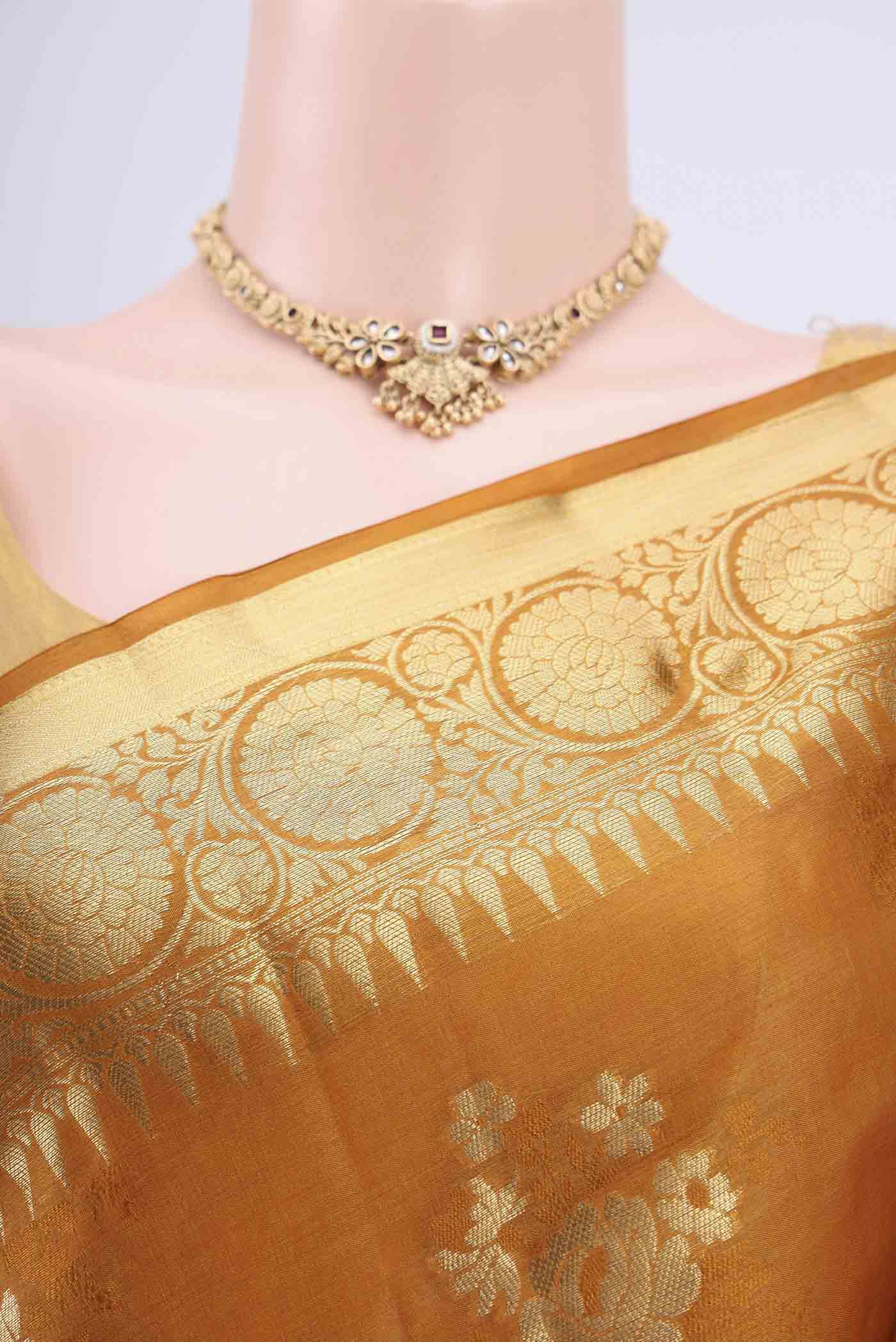 Border image of Mustard Banarasi Tussar Silk Saree with Zari Butta on the body and Zari Border. 