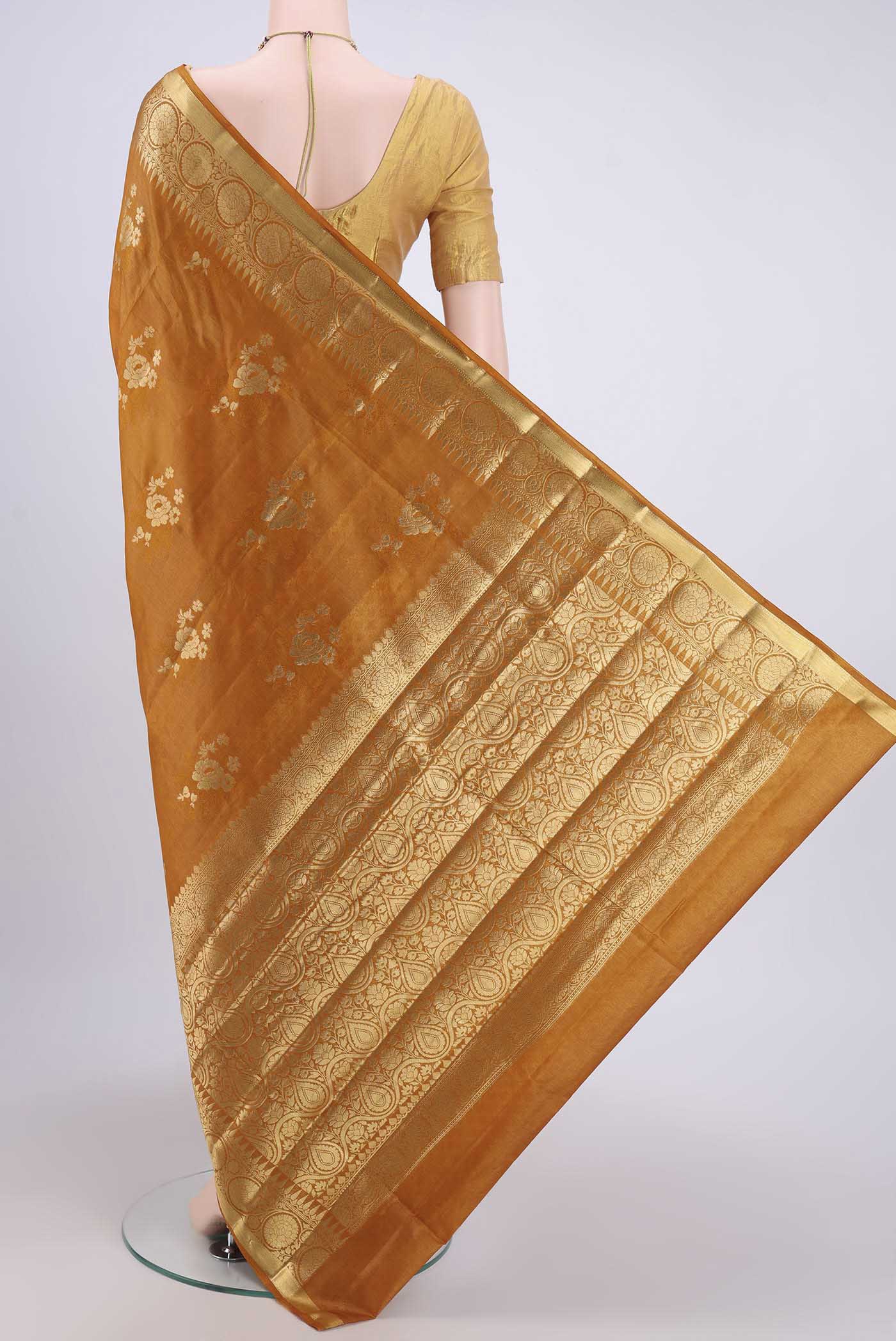 Flat view of Mustard Banarasi Tussar Silk Saree with Zari Butta on the body and Zari Border. 