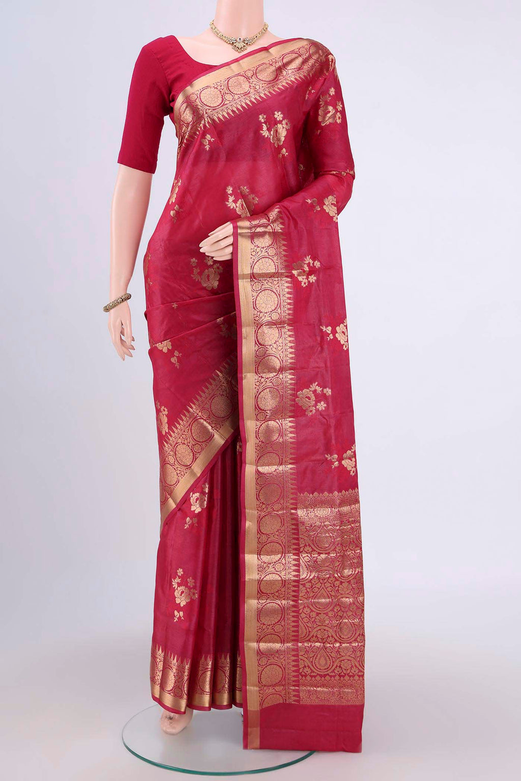 Dark Pink Banarasi Tussar Silk Saree with Zari Butta on the body and Zari Border.  displayed on a mannequin