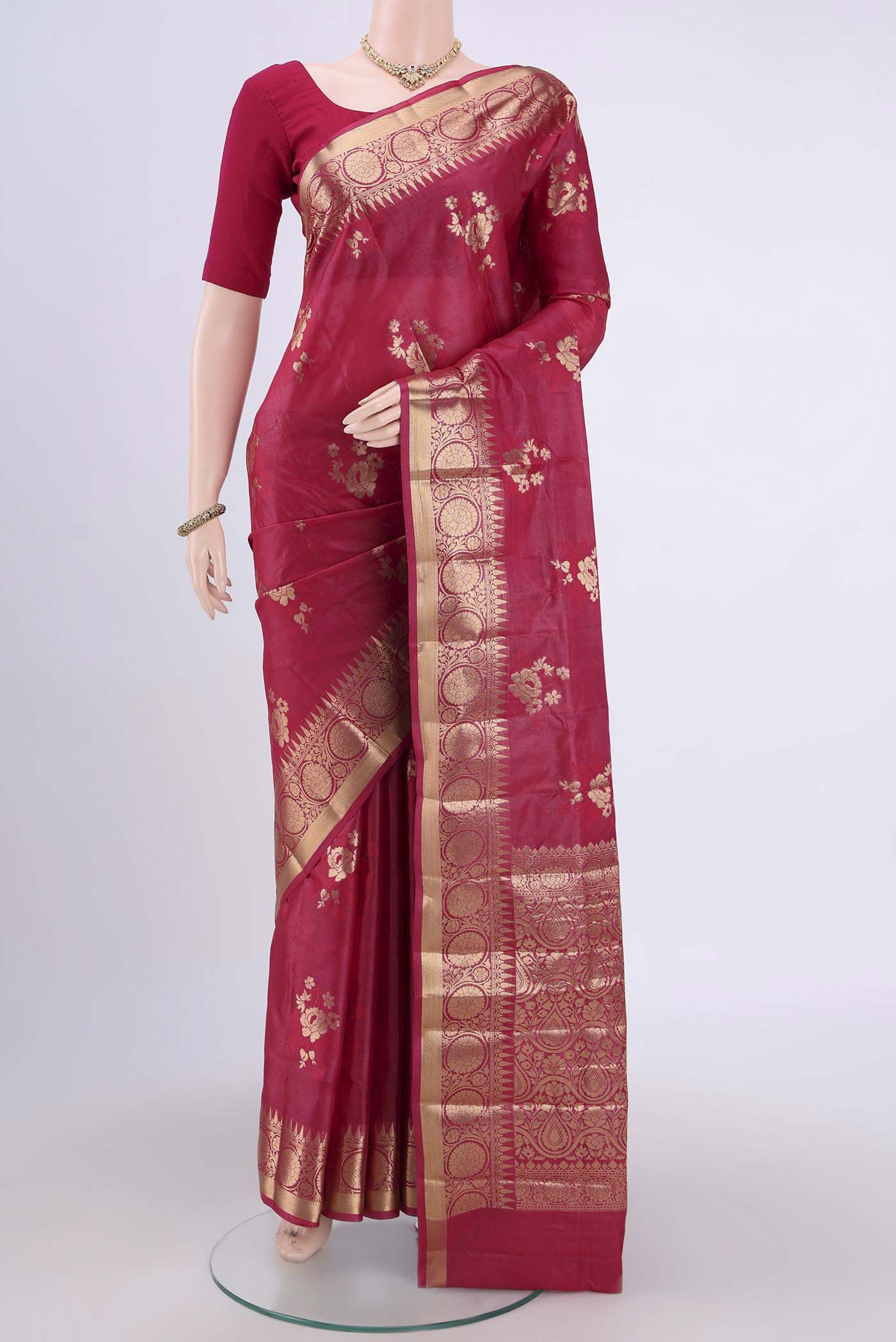 Dark Pink Banarasi Tussar Silk Saree with Zari Butta on the body and Zari Border.  displayed on a mannequin