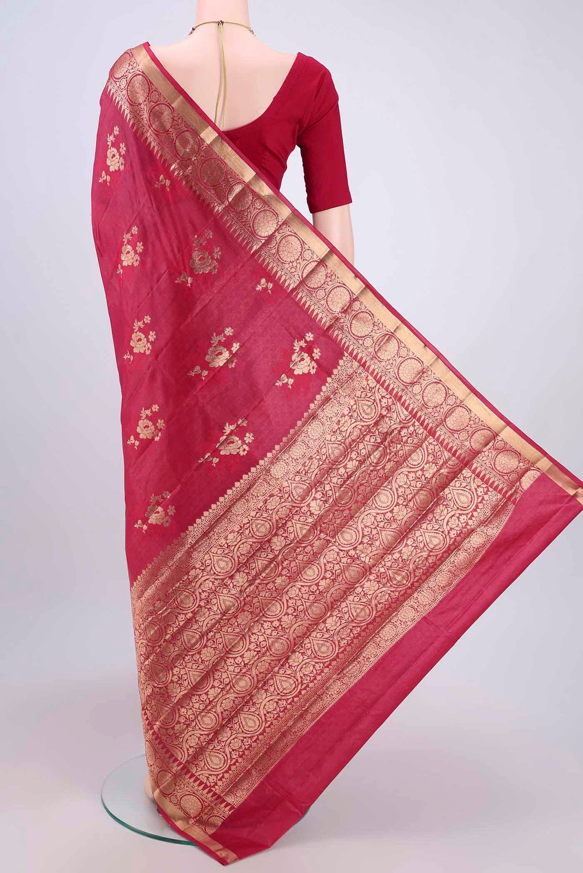 Flat view of Dark Pink Banarasi Tussar Silk Saree with Zari Butta on the body and Zari Border. 