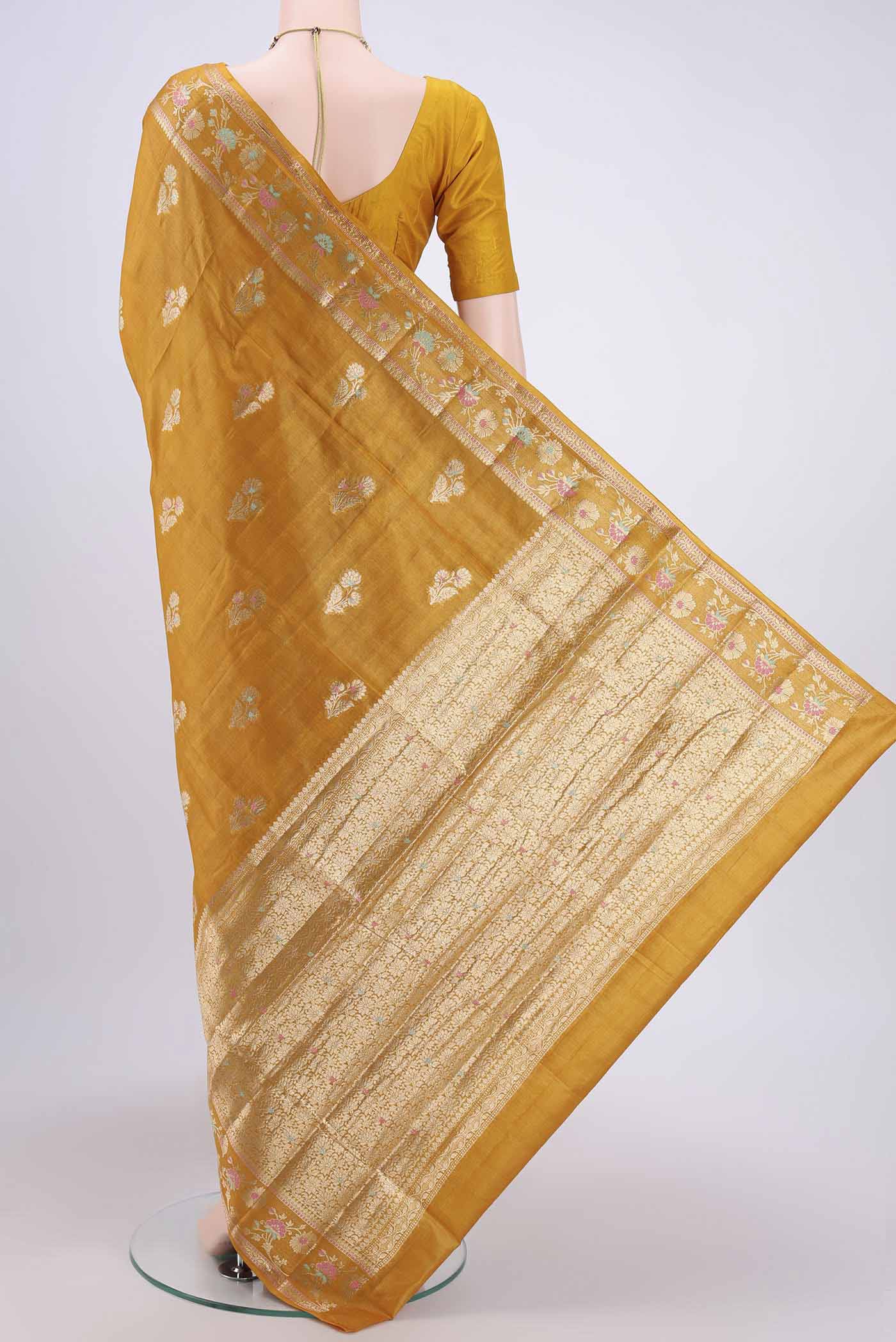 Flat view of Mustard Banarasi Tussar Silk Saree with Zari Butta on the body and Zari Border. 