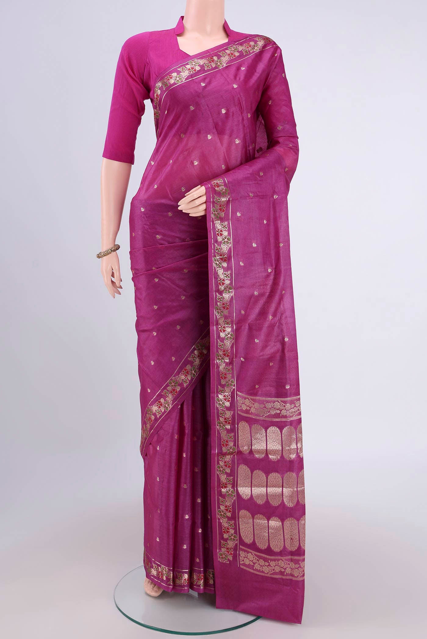 Mauve Banarasi Tussar Silk Saree with Zari Butta on the body and Zari Border.  displayed on a mannequin