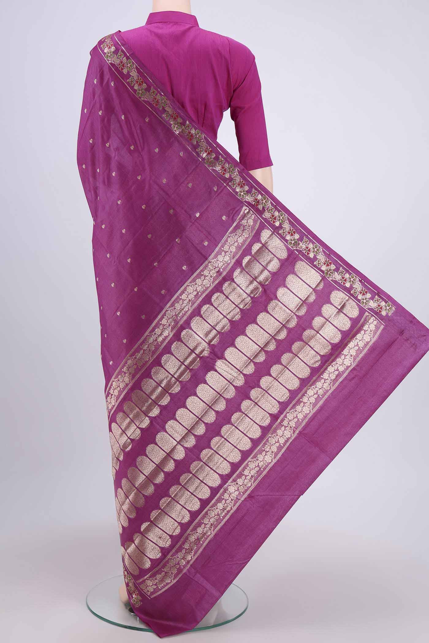 Flat view of Mauve Banarasi Tussar Silk Saree with Zari Butta on the body and Zari Border. 