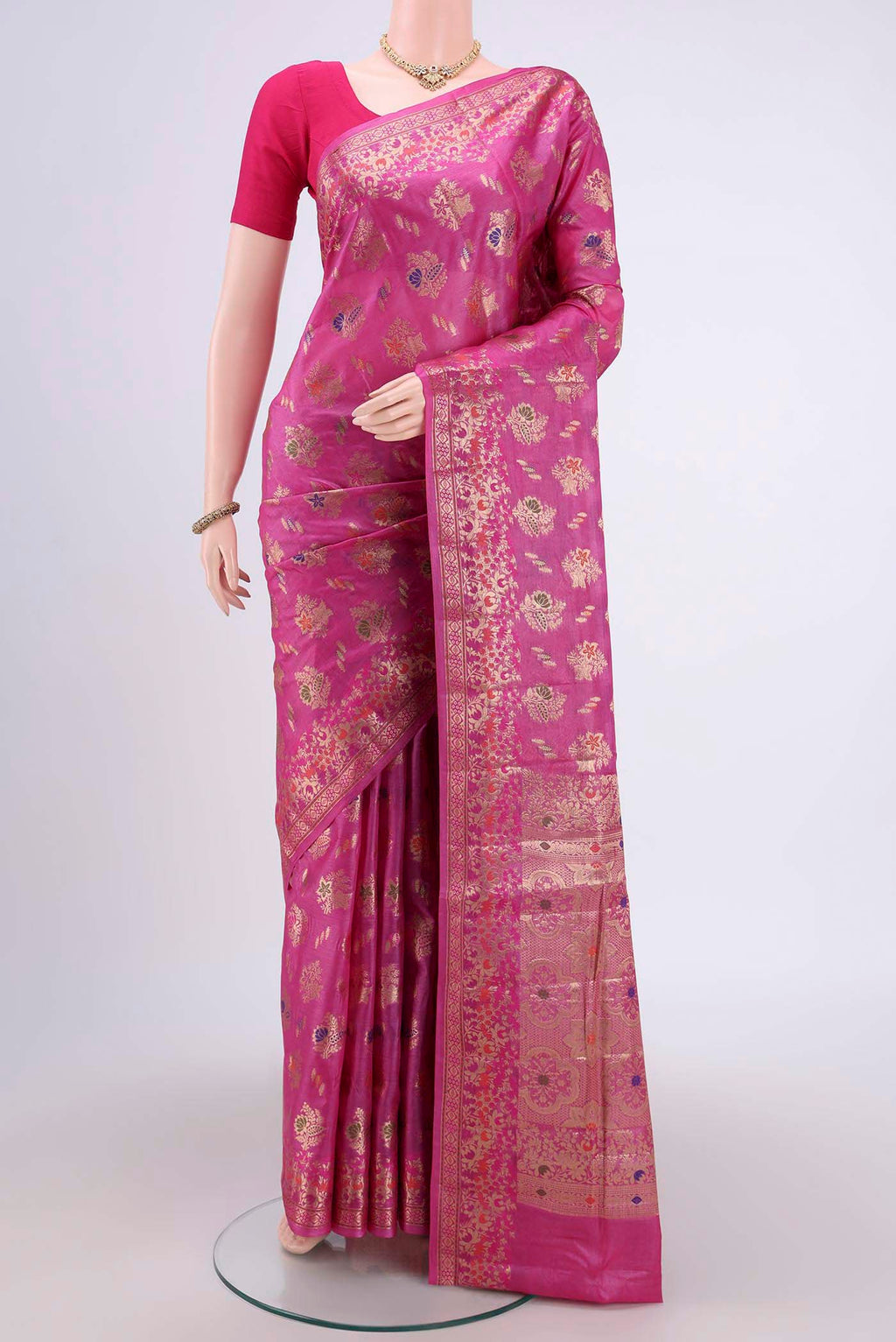 Pink Banarasi Tussar Silk Saree with Zari Butta on the body and Zari And Thread Border.  displayed on a mannequin