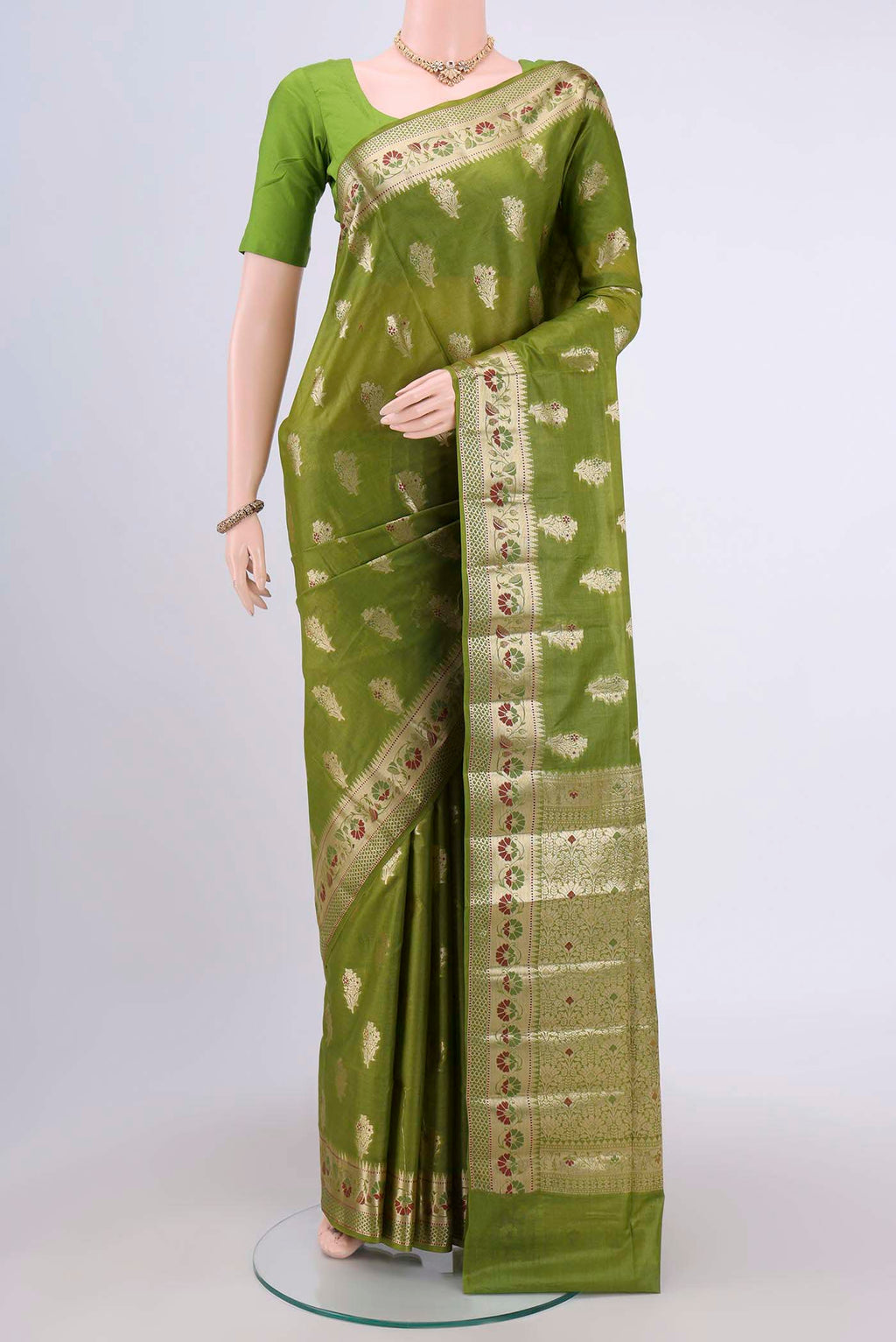 Green Banarasi Tussar Silk Saree with Zari Butta on the body and Zari Border.  displayed on a mannequin