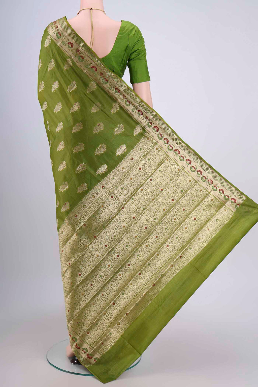 Flat view of Green Banarasi Tussar Silk Saree with Zari Butta on the body and Zari Border. 