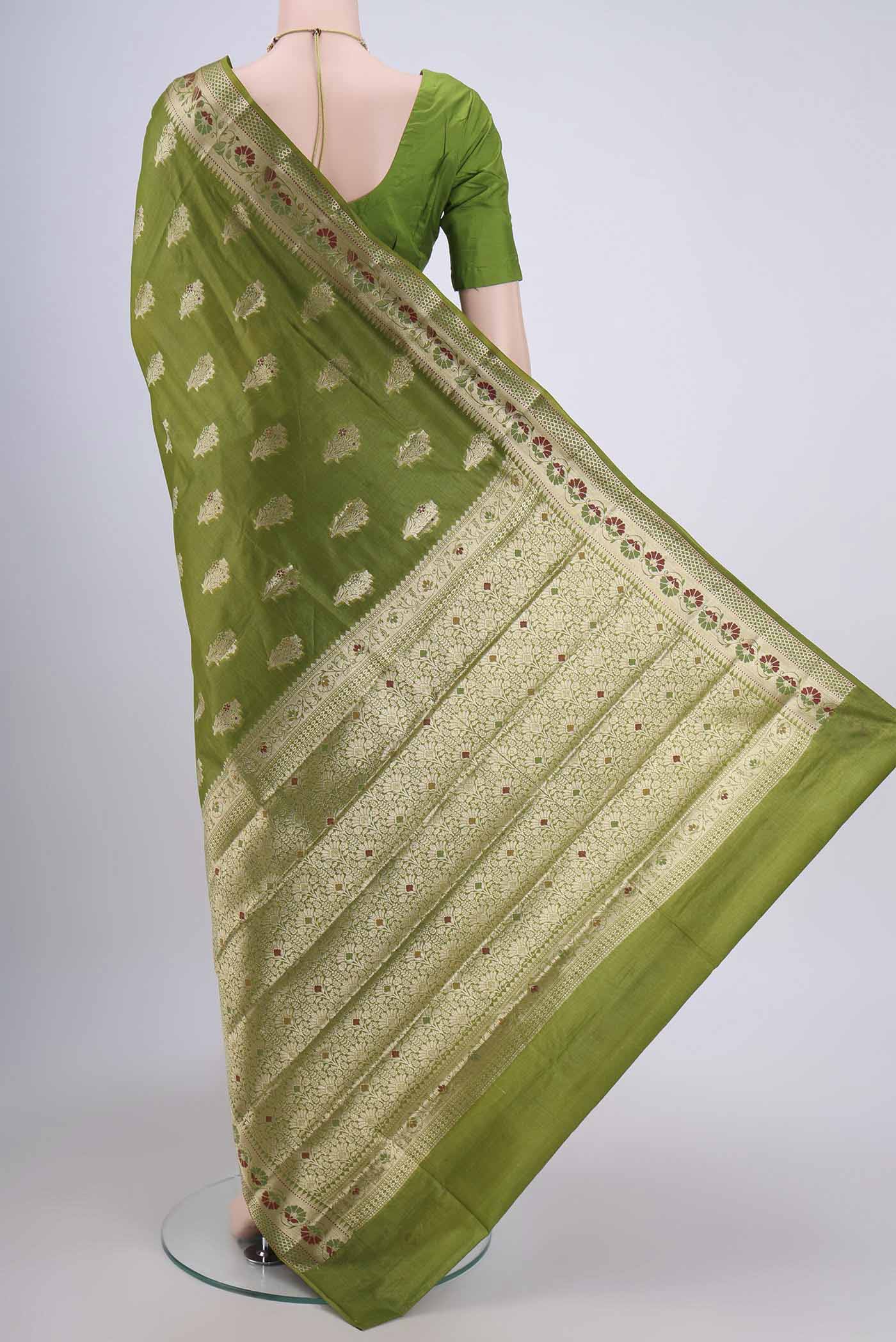 Flat view of Green Banarasi Tussar Silk Saree with Zari Butta on the body and Zari Border. 