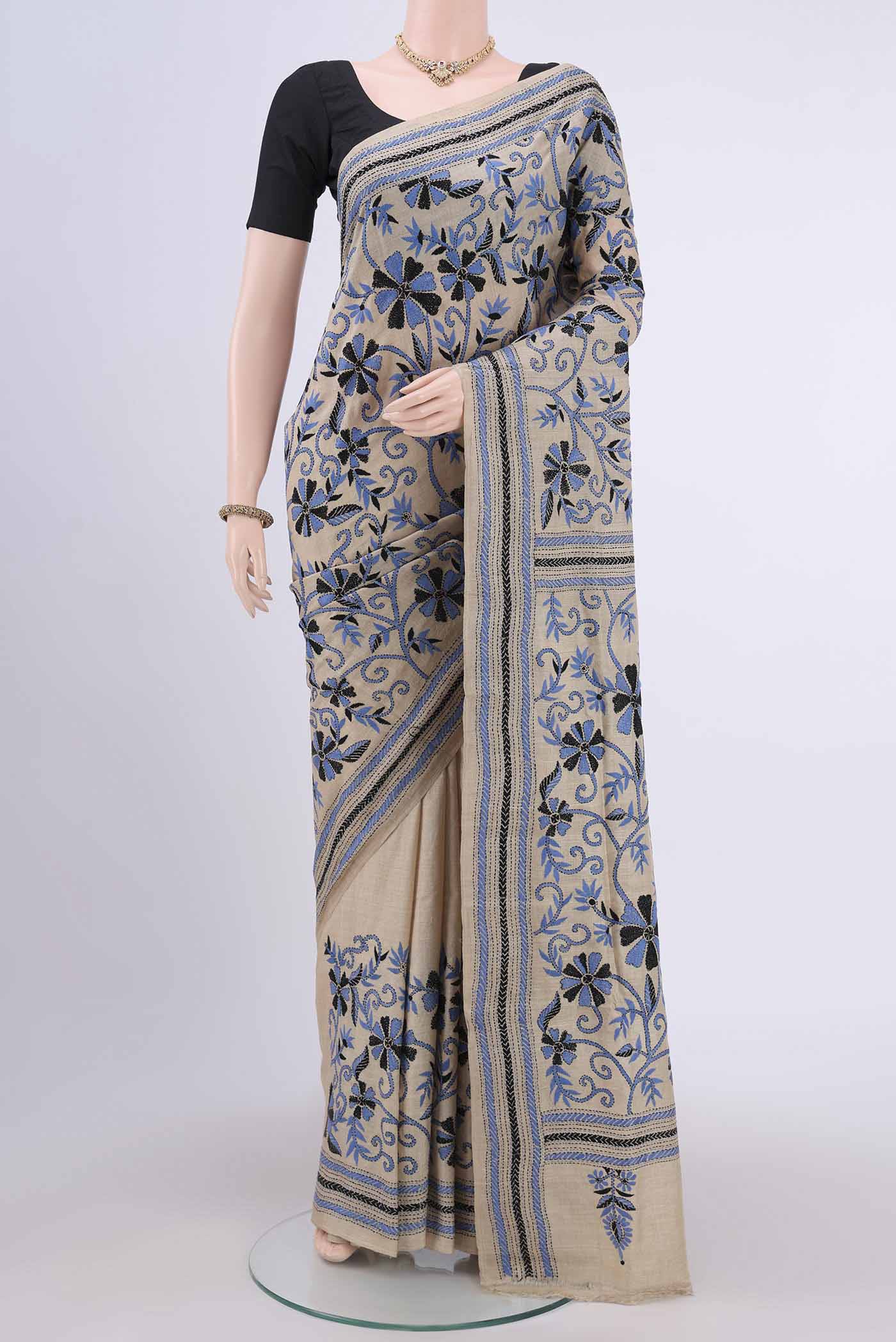 Beige Kantha Silk Saree with Kantha Work on the body and Thread Border.  displayed on a mannequin
