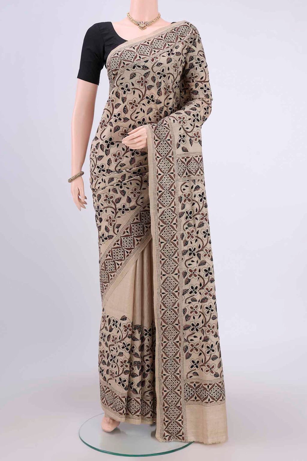 Beige Kantha Silk Saree with Kantha Work on the body and Thread Border.  displayed on a mannequin
