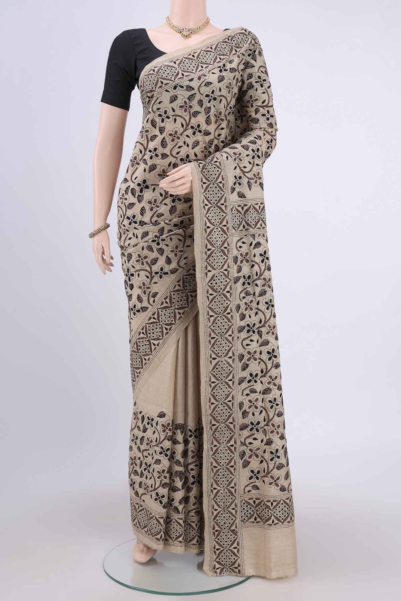 Beige Kantha Silk Saree with Kantha Work on the body and Thread Border.  displayed on a mannequin