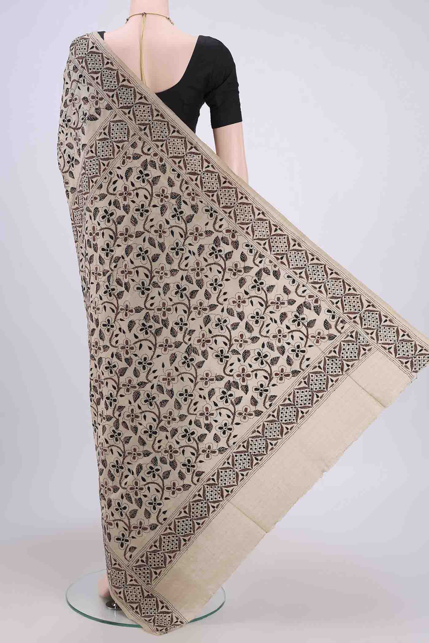 Flat view of Beige Kantha Silk Saree with Kantha Work on the body and Thread Border. 