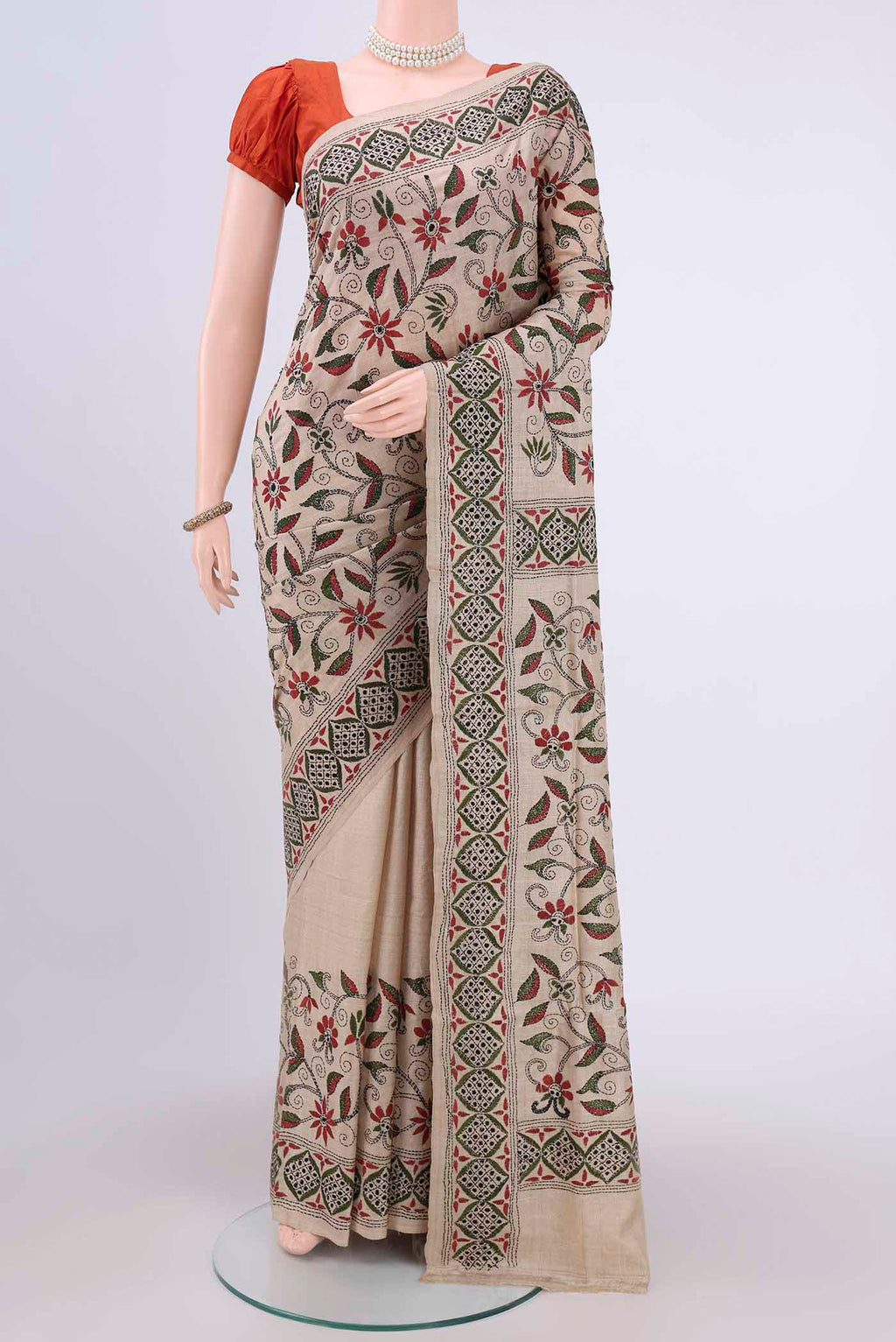 Beige Kantha Silk Saree with Kantha Work on the body and Thread Border.  displayed on a mannequin