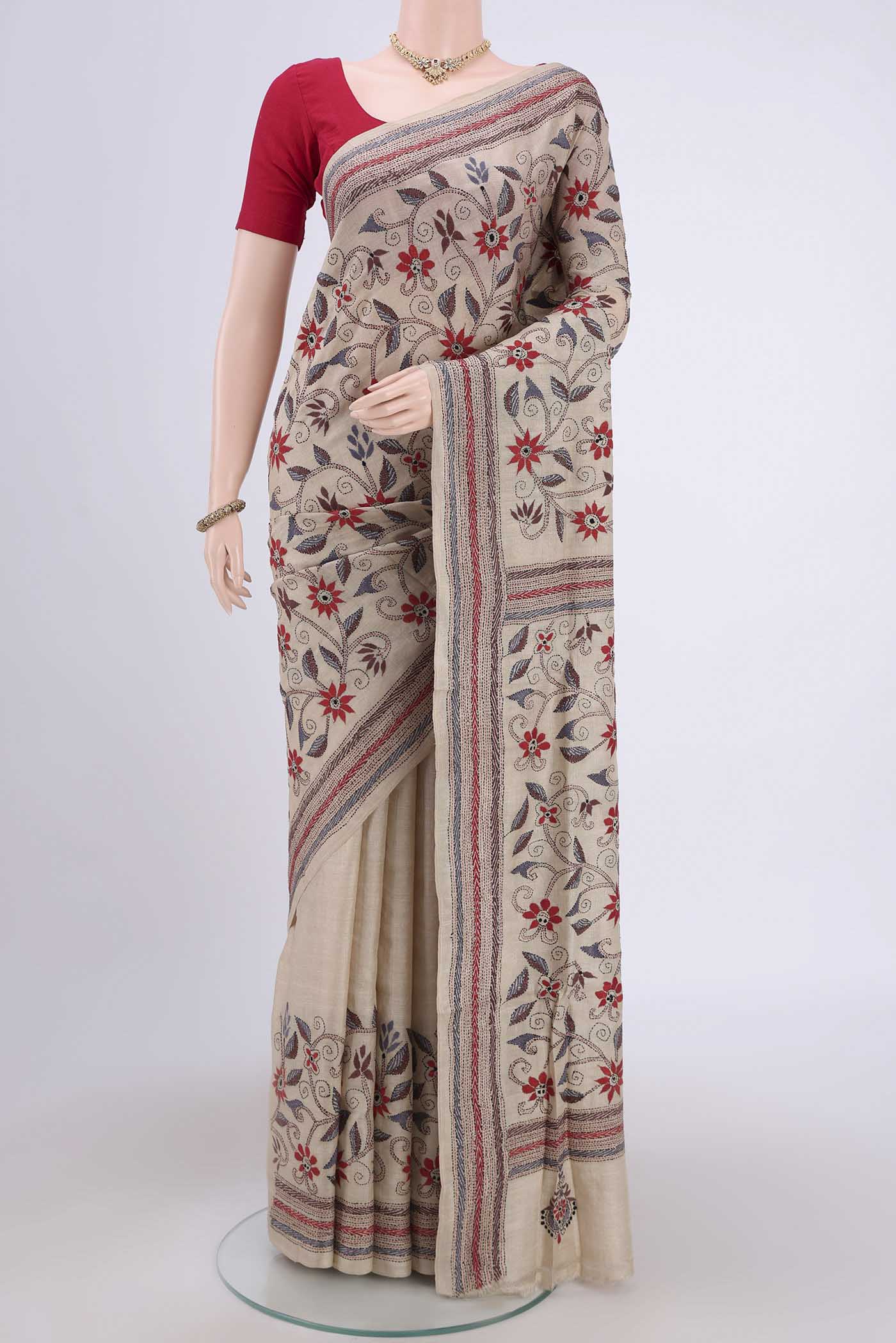 Beige Kantha Silk Saree with Kantha Work on the body and Thread Border.  displayed on a mannequin