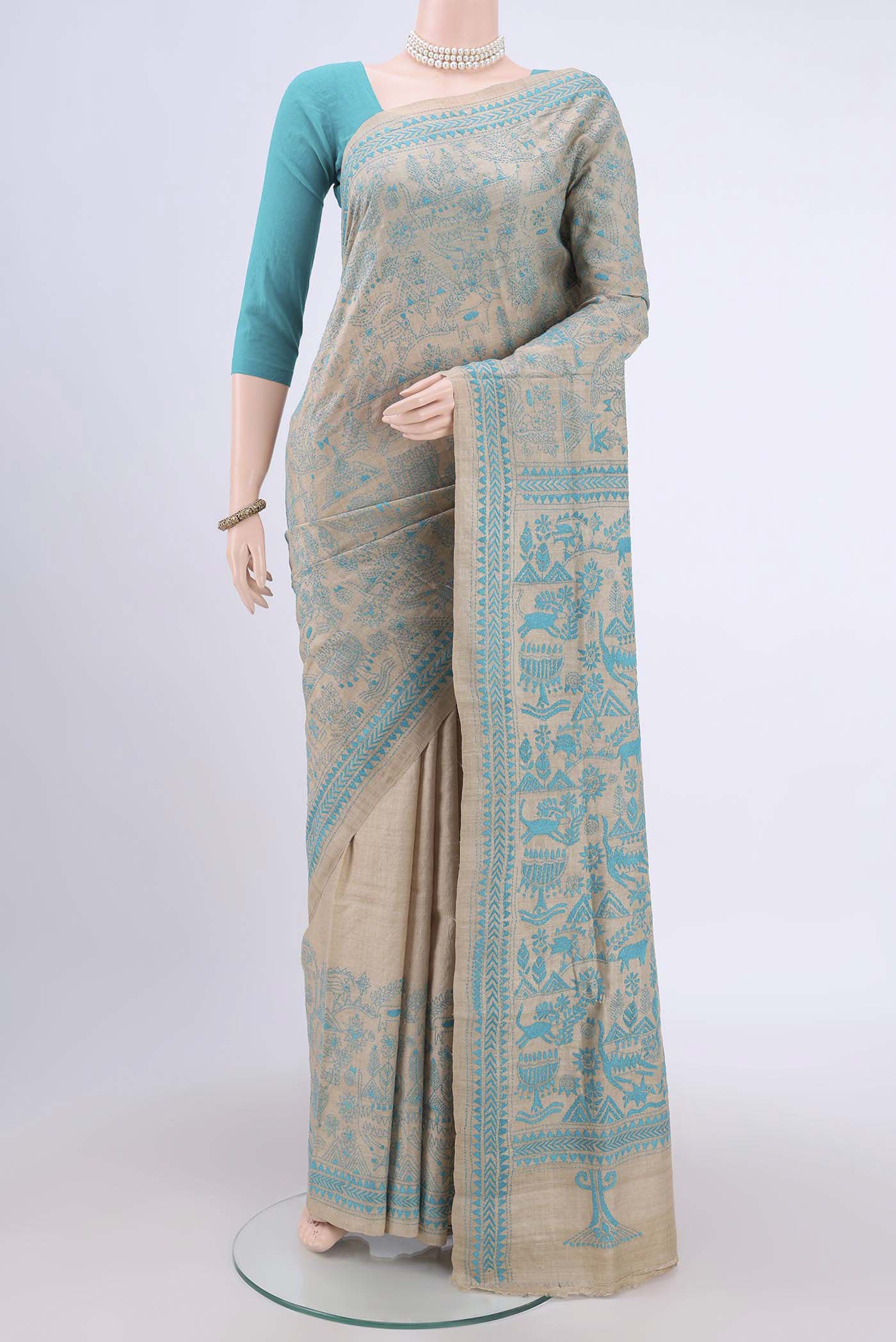 Beige Kantha Silk Saree with Kantha Work on the body and Thread Border.  displayed on a mannequin