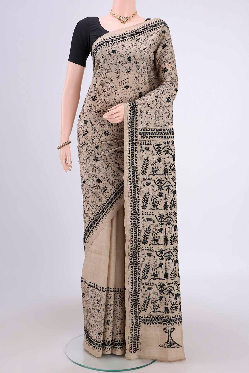 Beige Kantha Silk Saree with Kantha Work on the body and Thread Border.  displayed on a mannequin