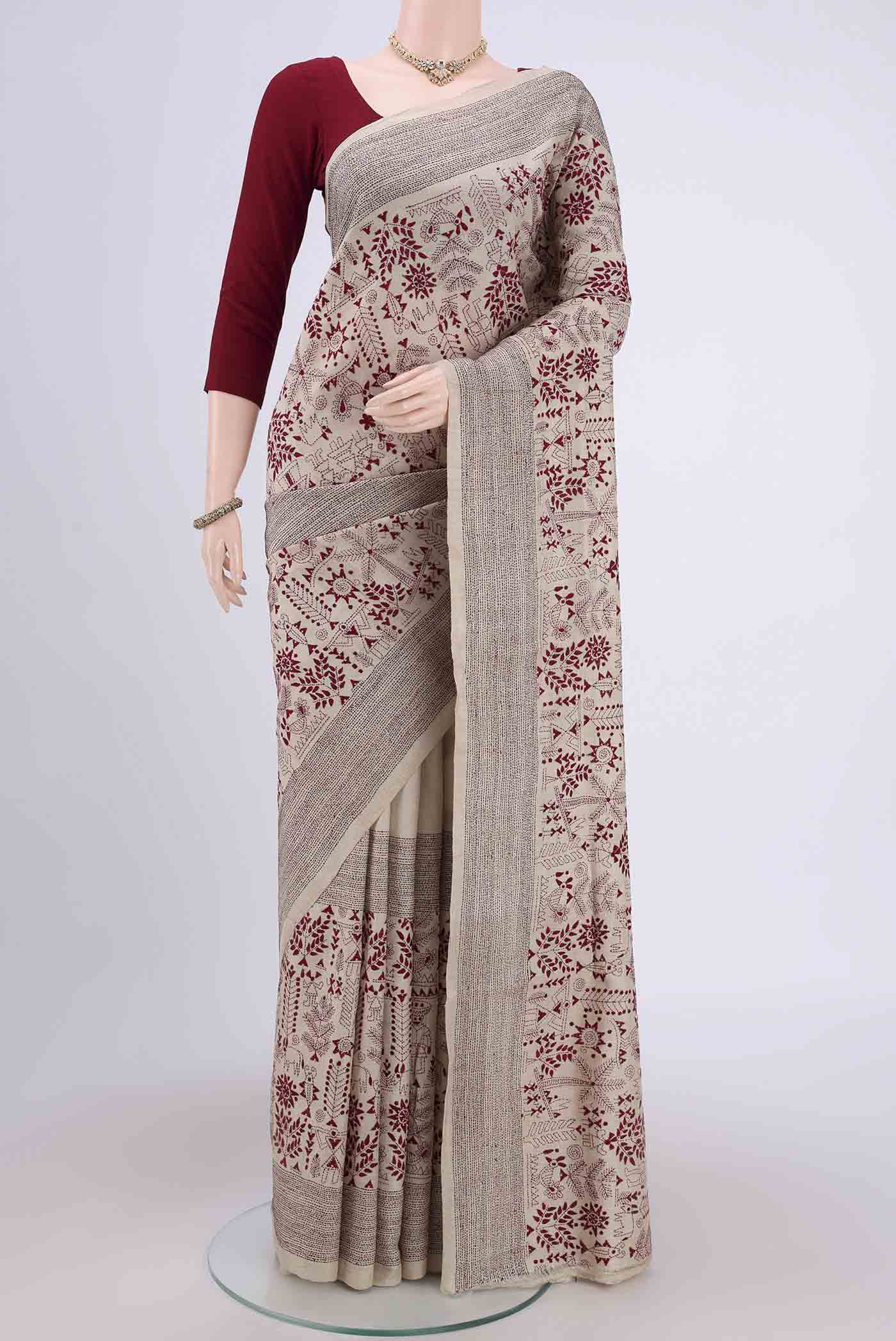 Beige Kantha Silk Saree with Kantha Work on the body and Thread Border.  displayed on a mannequin