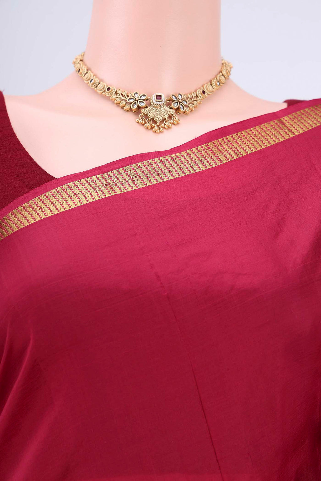 Border image of Maroon Kanchipuram Silk Saree with Plain Body and Zari Border. 