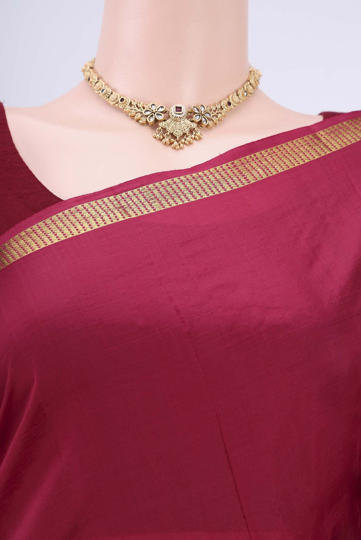 Border image of Maroon Kanchipuram Silk Saree with Plain Body and Zari Border. 